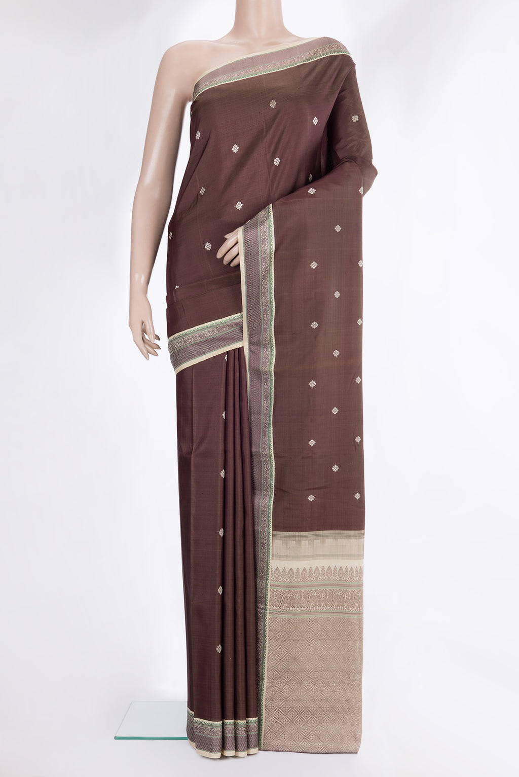Pure Silk Brown Kanjivaram Saree with Thread Butta on the body and Thread Border.  displayed on a mannequin