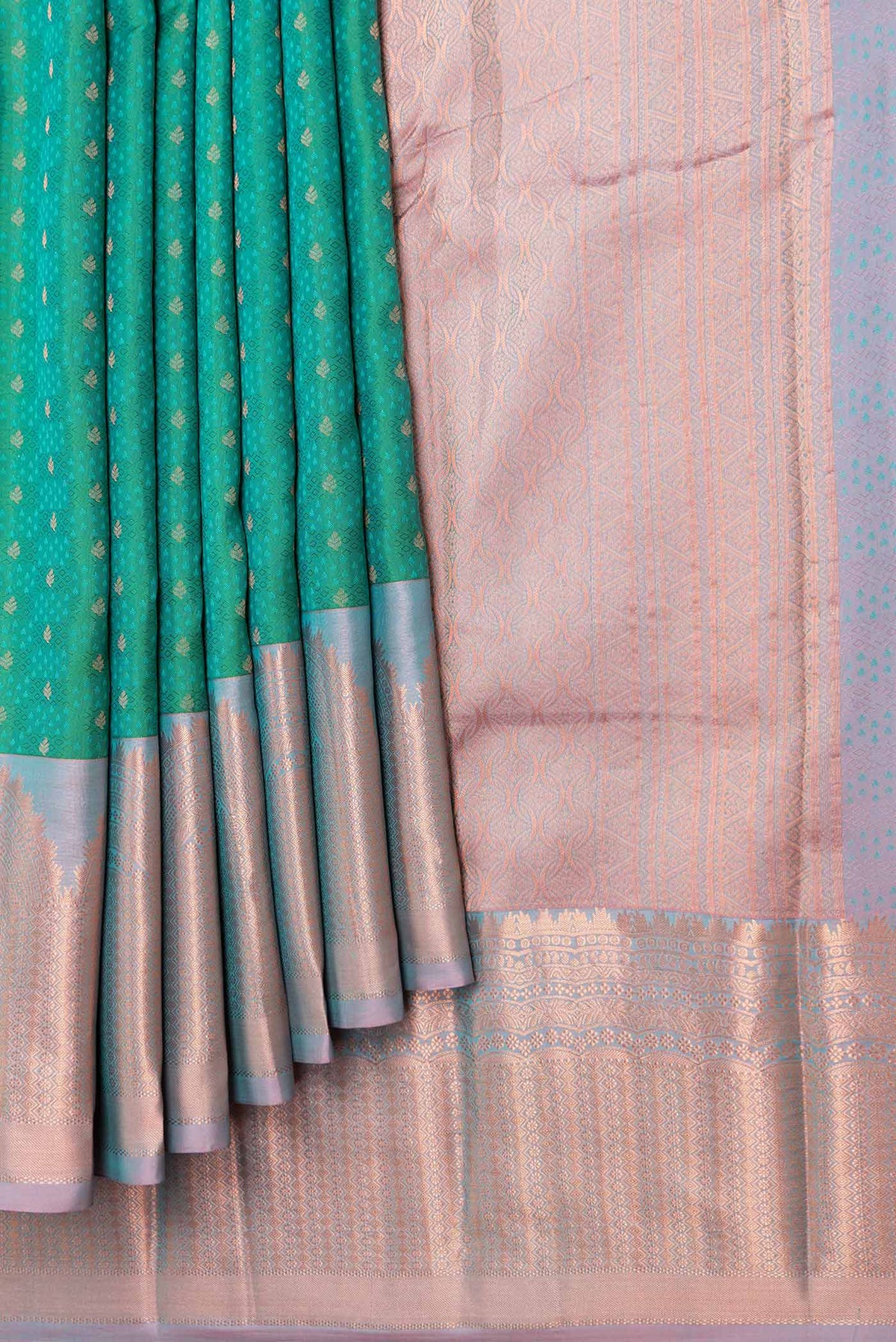 Pleats and pallu of Green Dual Tone Kanchipuram Saree with Zari Butta on the body and Zari Border