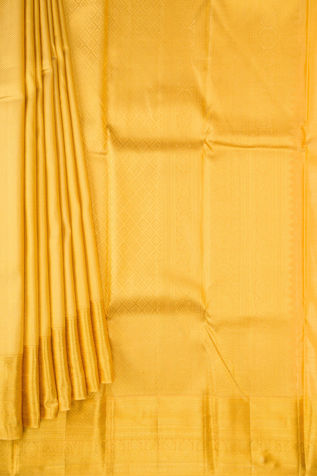 Pleats and pallu of Yellow Kanjivaram Silk Saree with Zari Brocade on the body and Zari Border. 