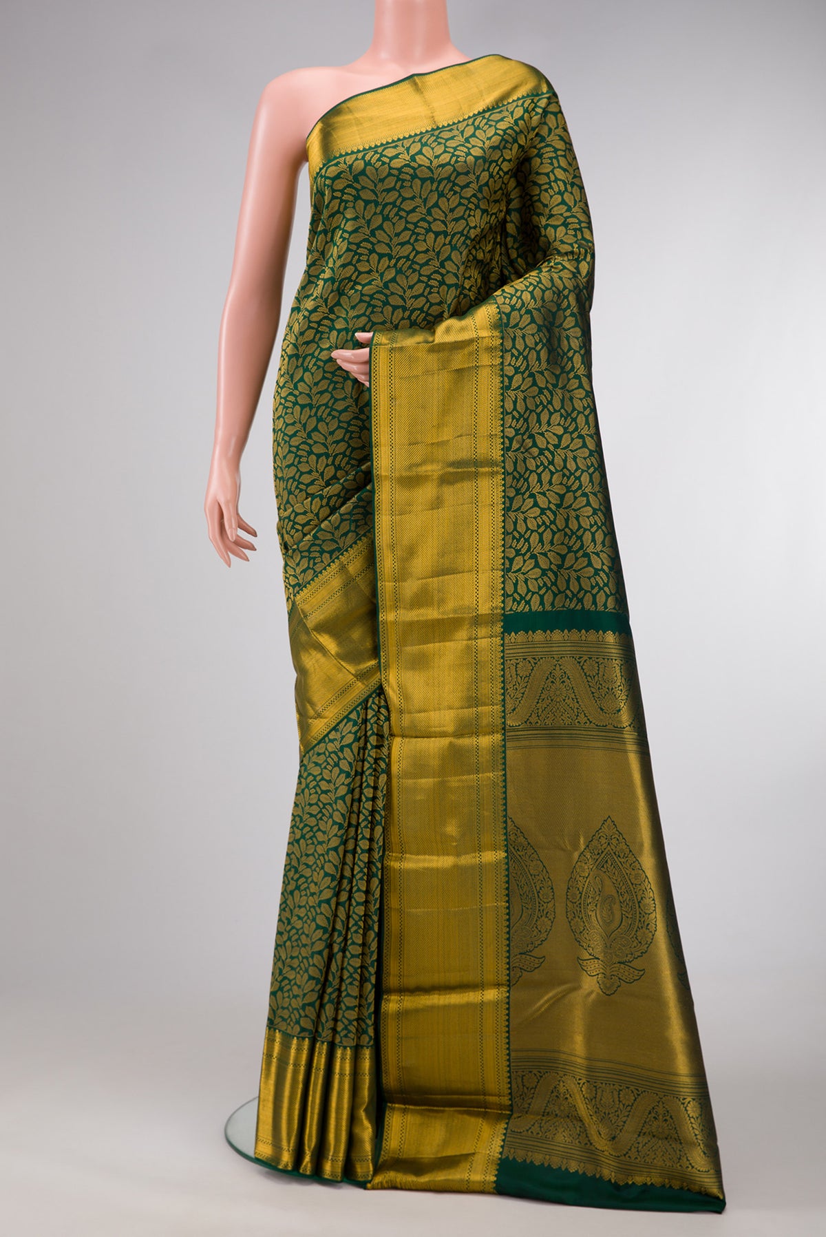 Green Dual Tone Kanjivaram Silk Saree with Zari Brocade on the body and Zari Border.  displayed on a mannequin