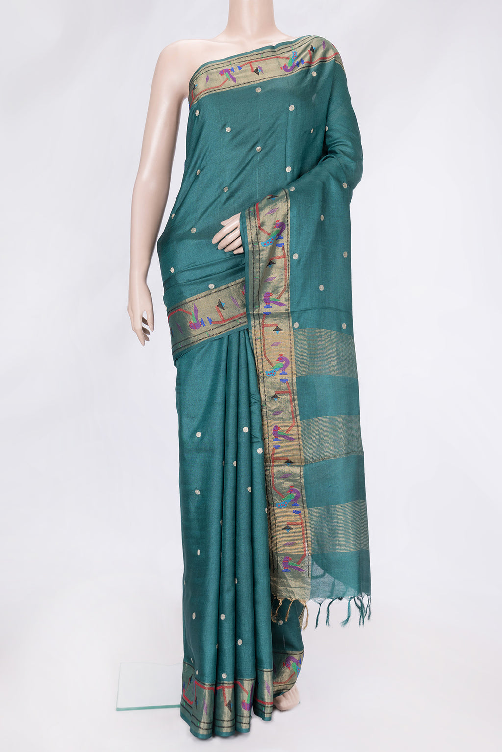 Green Dual Tone Tussar Silk Saree with Zari Butta on the body and Zari And Thread Border.  displayed on a mannequin