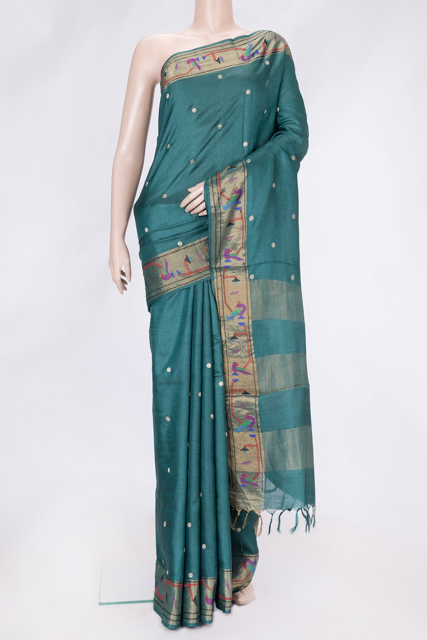Green Dual Tone Tussar Silk Saree with Zari Butta on the body and Zari And Thread Border.  displayed on a mannequin