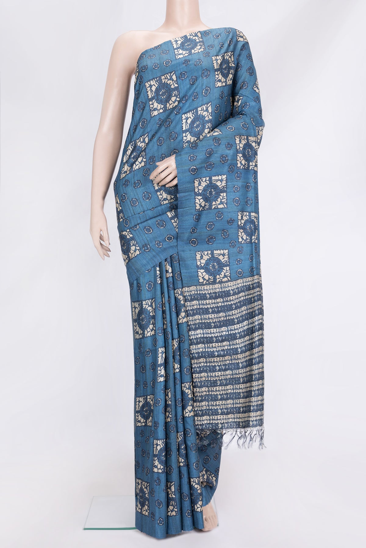 Blue Dual Tone Tussar Silk Saree with Printed design on the body and Without Border.  displayed on a mannequin