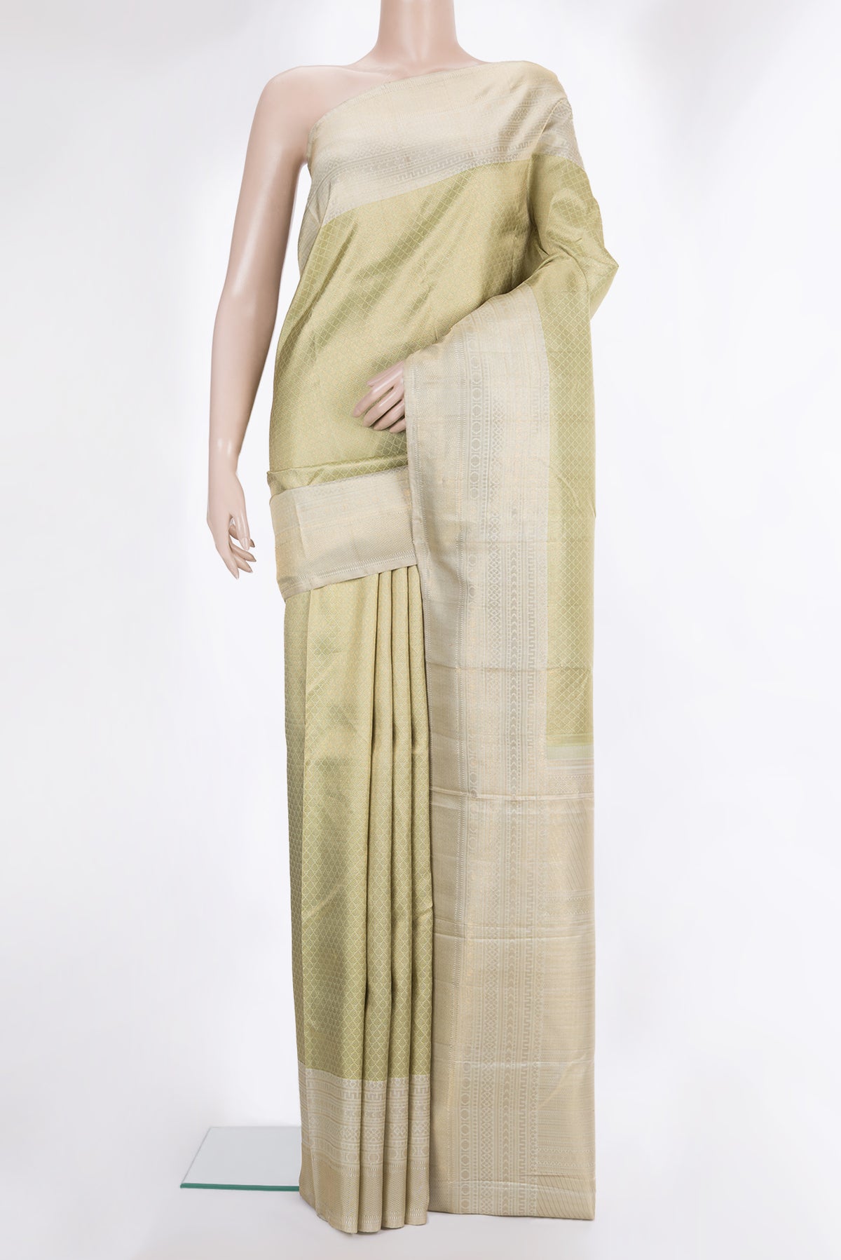 Pure Silk Gold Kanchipuram Saree with Zari Brocade on the body and Zari Border.  displayed on a mannequin