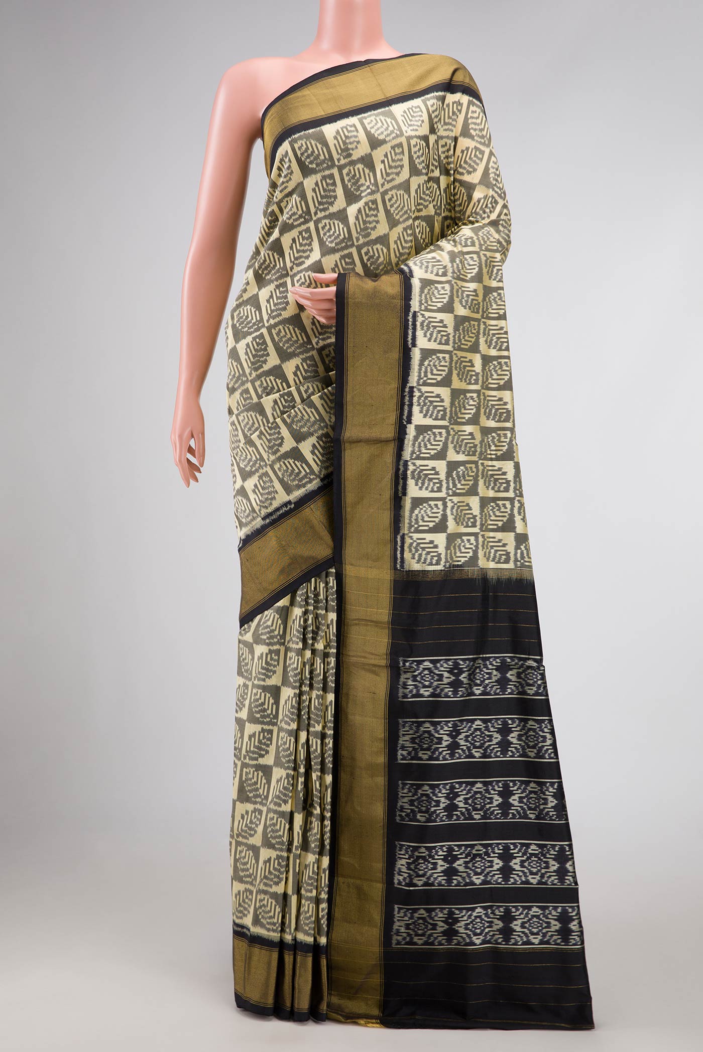 Sandal Pochampally Silk Saree with Pure Ikat on the body and Zari Border displayed on a mannequin