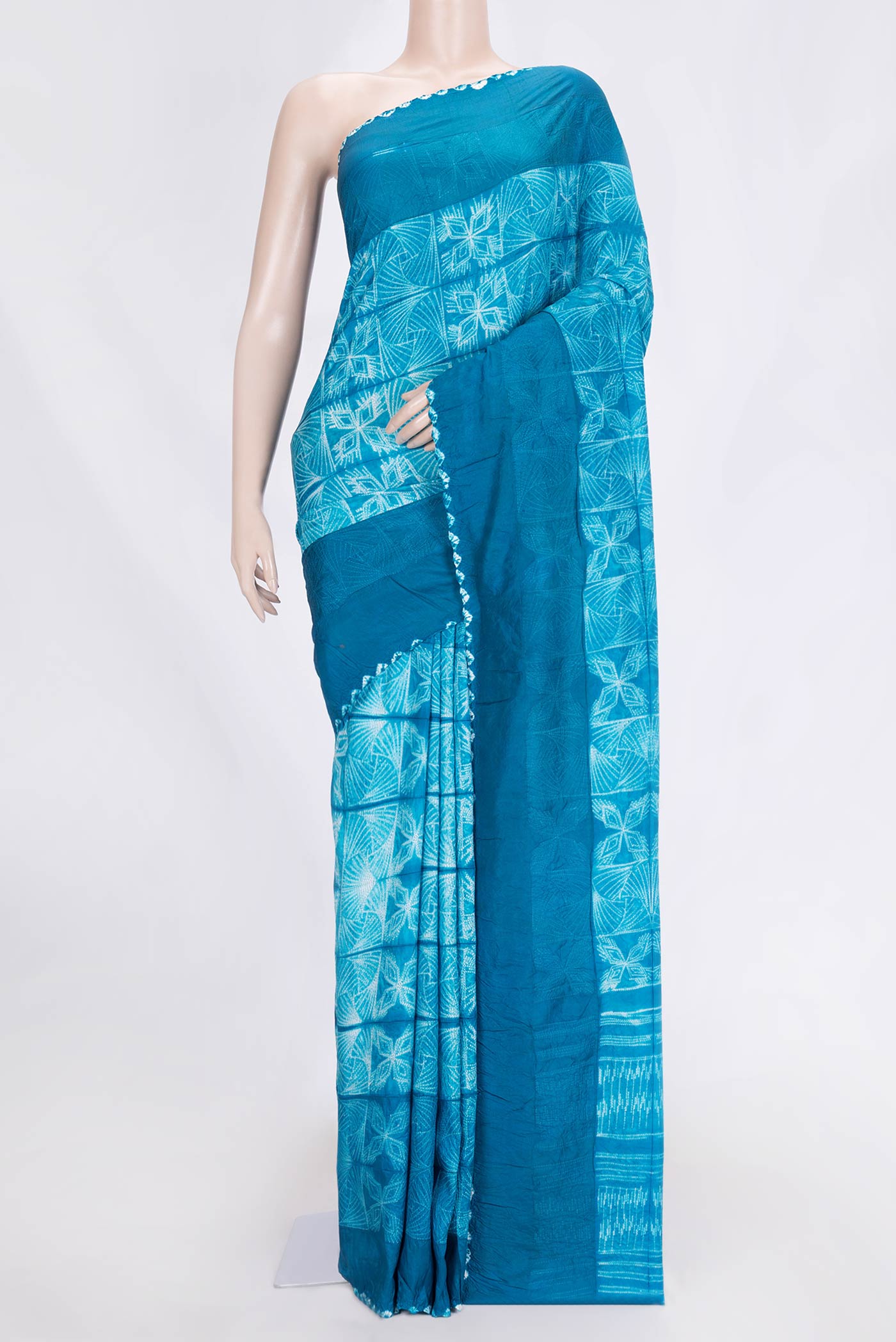 Sky Blue Dual Tone Tussar Saree with Printed design on the body and Embroidery Border.  displayed on a mannequin