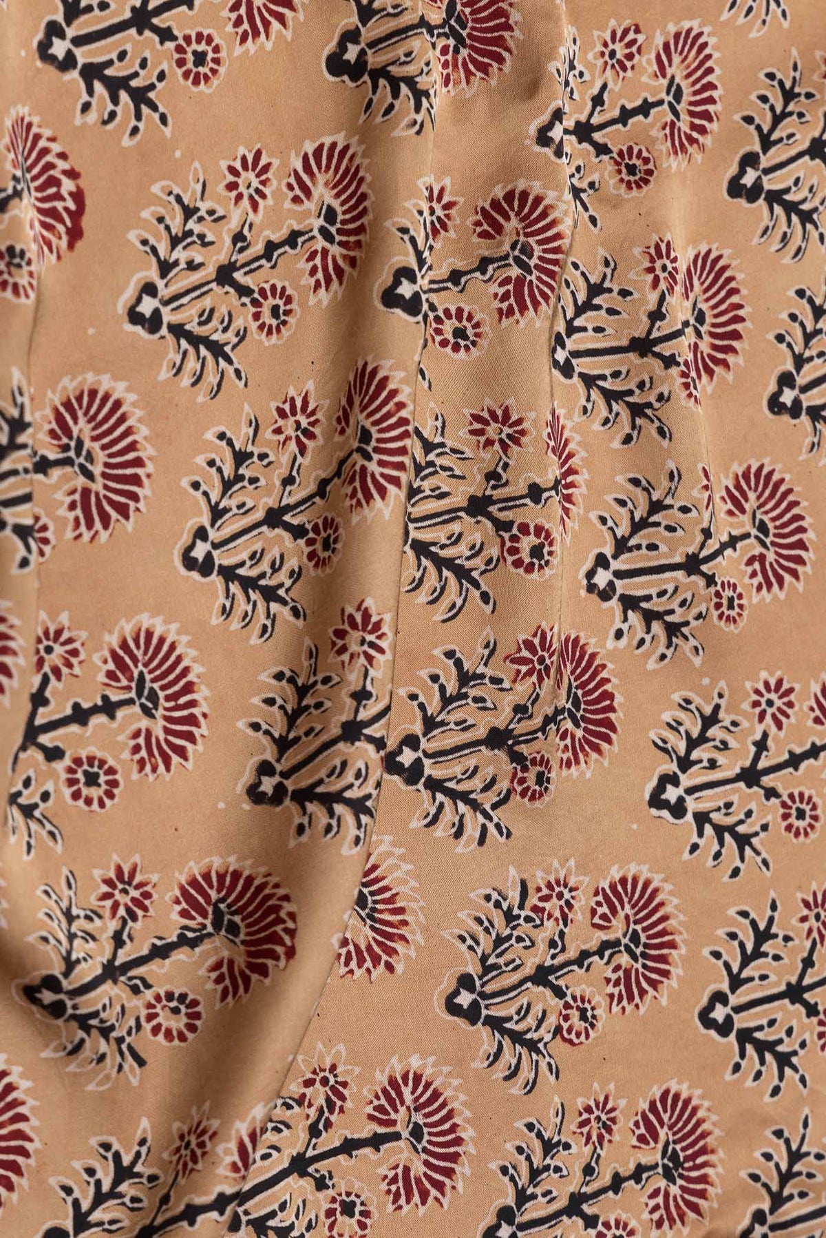 Close up of Sandal Dual Tone Satin Silk Saree with Printed design on the body and Printed Border displaying folds