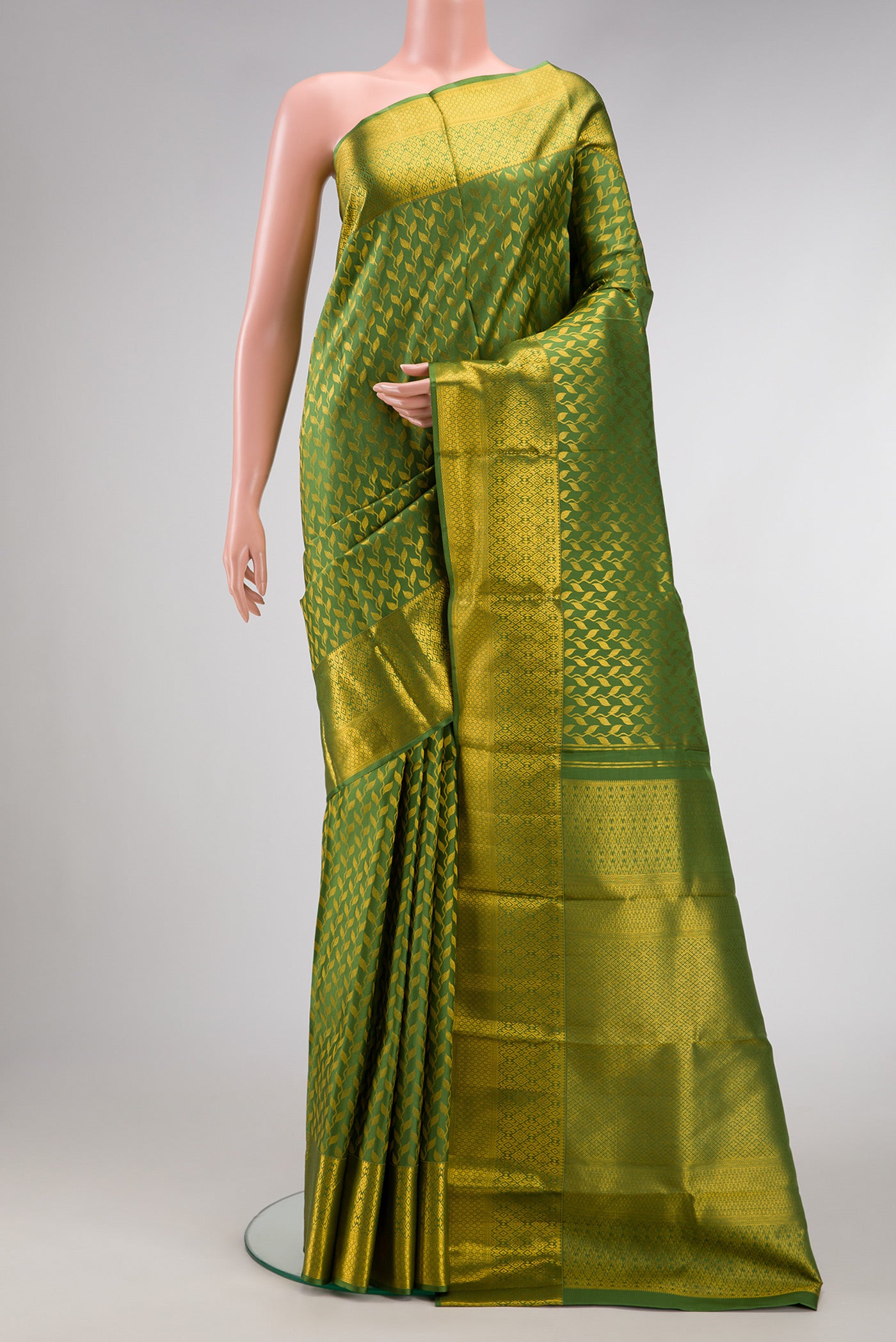 Mehandi Green Dual Tone Kanchipuram Silk Saree with Zari Brocade on the body and Zari Border.  displayed on a mannequin
