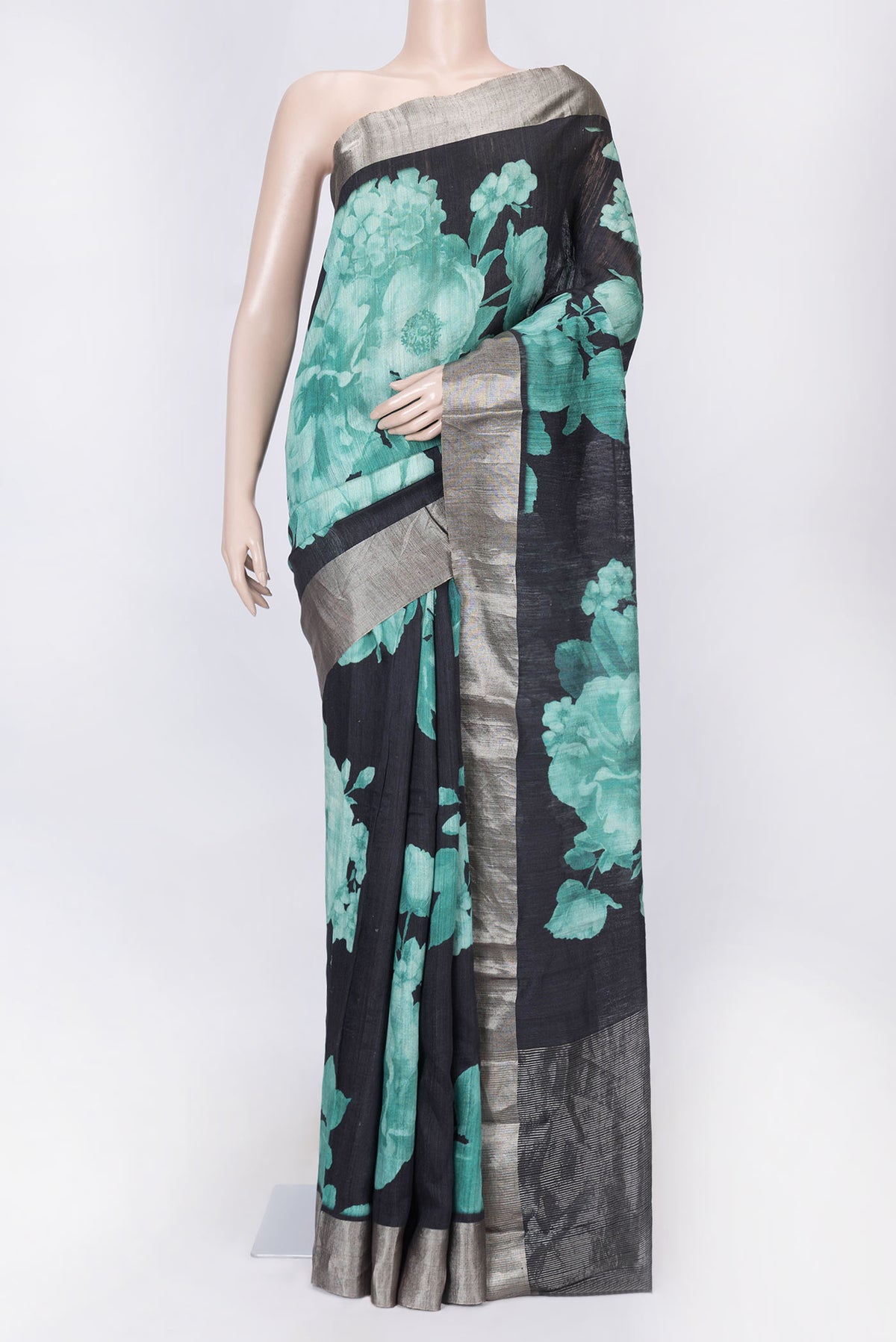 Black Dual Tone Tussar Silk Saree with Printed design on the body and Zari Border displayed on a mannequin