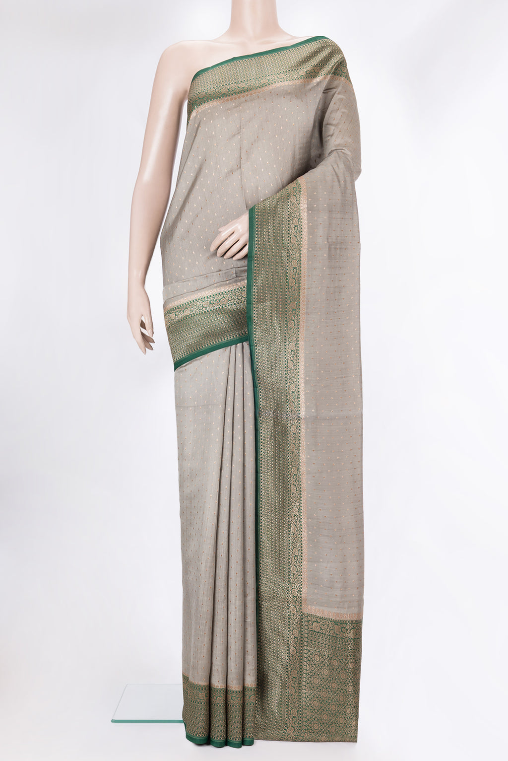 Pure Silk Grey Tussar Saree with Zari Butta on the body and Zari Border.  displayed on a mannequin
