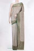Pure Silk Grey Tussar Saree with Zari Butta on the body and Zari Border.  displayed on a mannequin