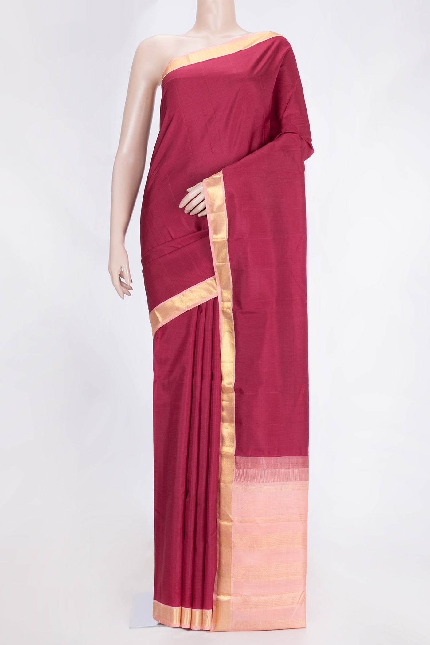 Maroon Dual Tone Kanchipuram Saree with Plain Body and Zari Border.  displayed on a mannequin