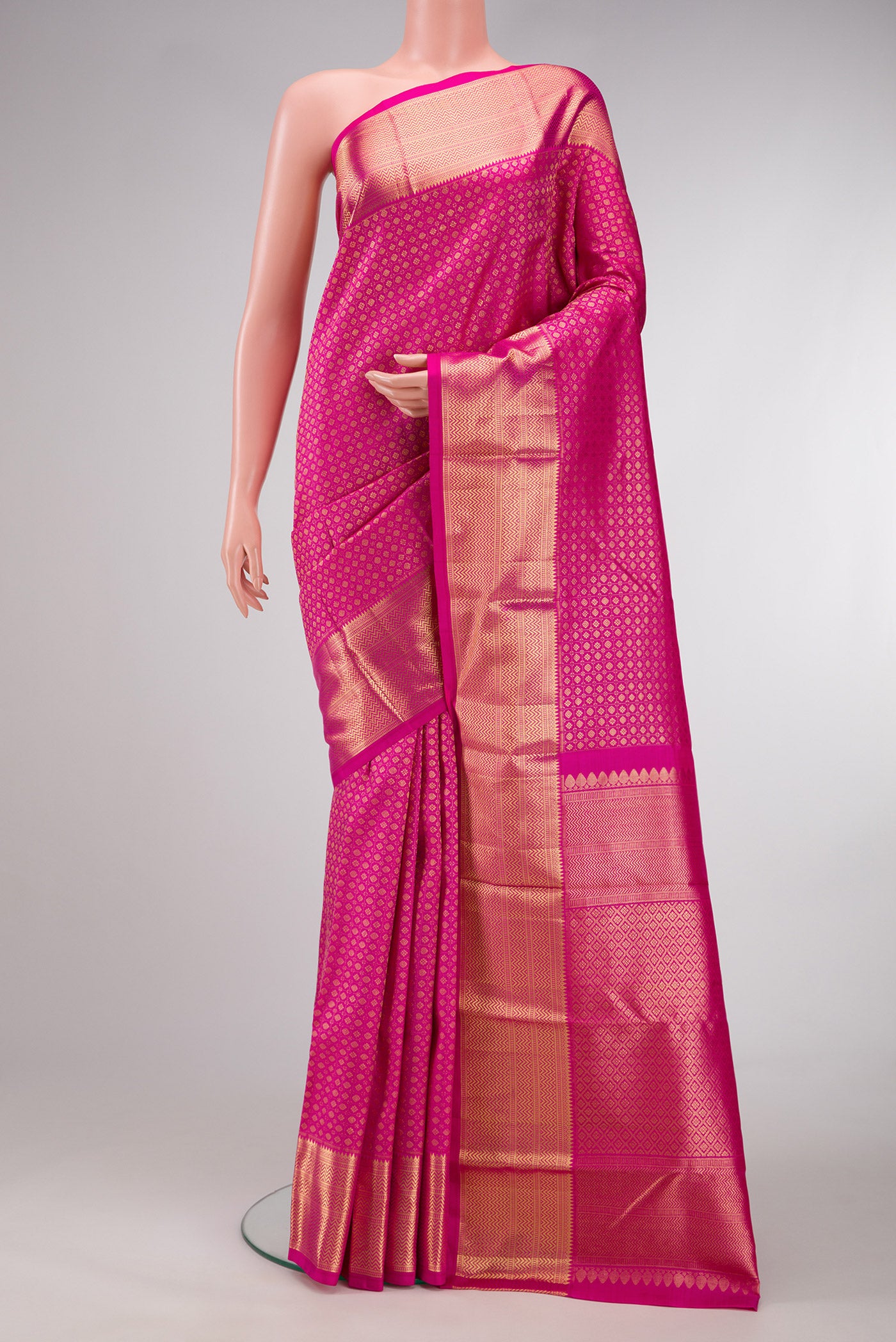 Pink Dual Tone Kanjivaram Silk Saree with Zari Brocade on the body and Zari Border.  displayed on a mannequin