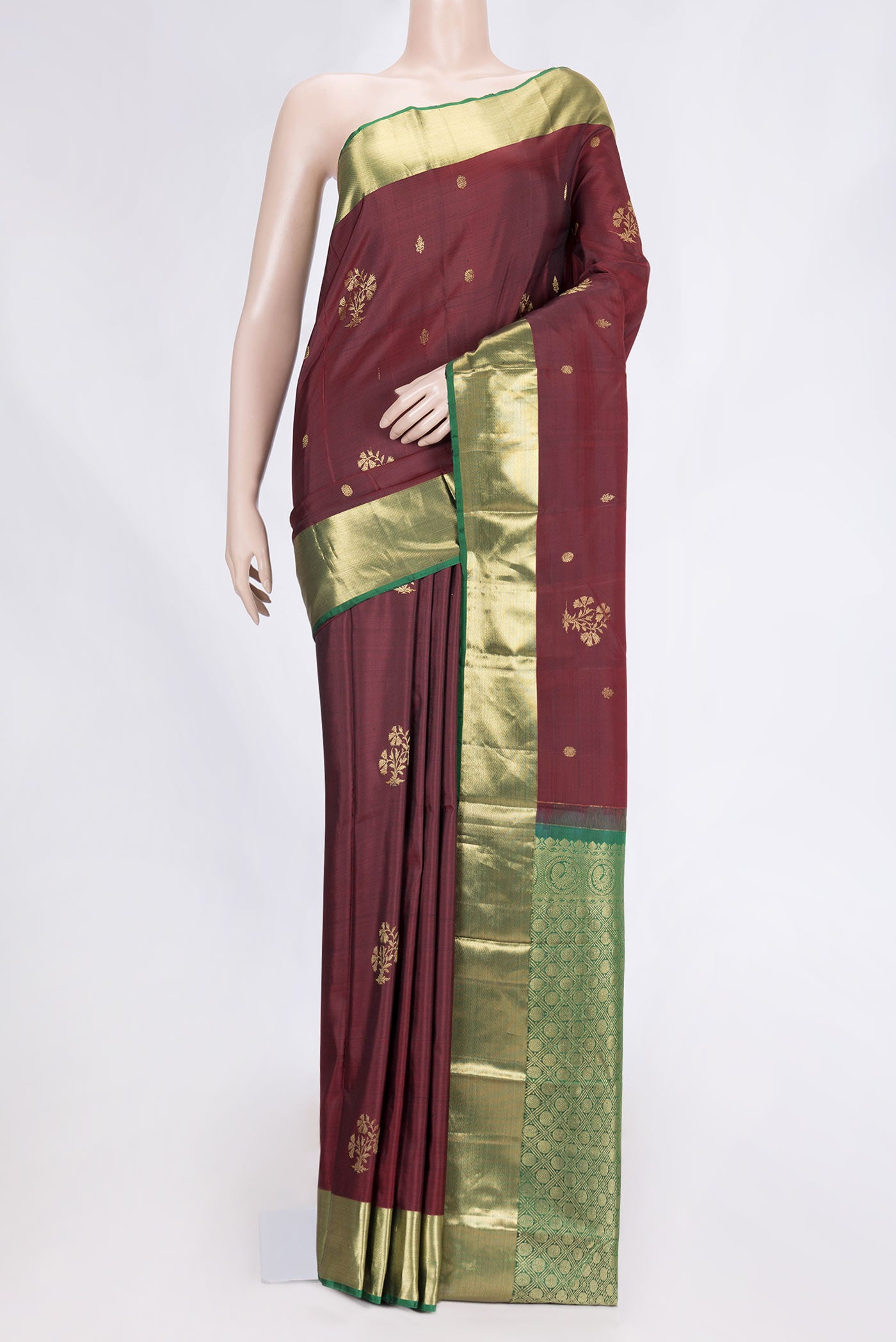 Maroon Dual Tone Kanchipuram Silk Saree with Zari Butta on the body and Zari Border.  displayed on a mannequin
