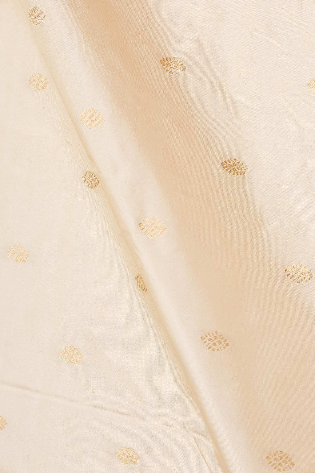 Close up of Cream Paithani Silk Saree with Zari Butta on the body and Paithani Border displaying folds