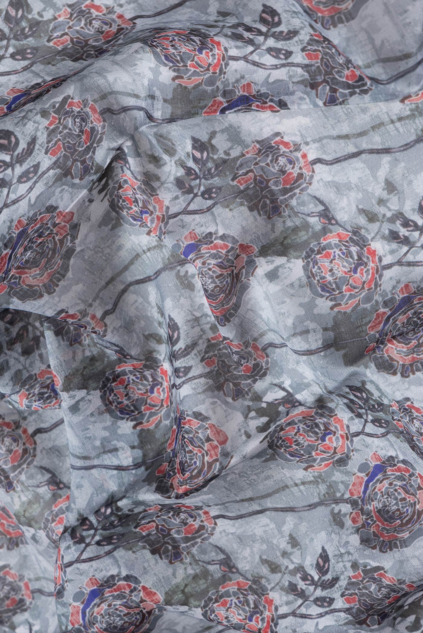 Close up of Grey Dual Tone Mysore Silk Saree with Printed design on the body and Zari Border.  displaying folds