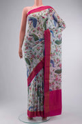 Grey Mysore Crepe Saree with Printed design on the body and Zari Border displayed on a mannequin