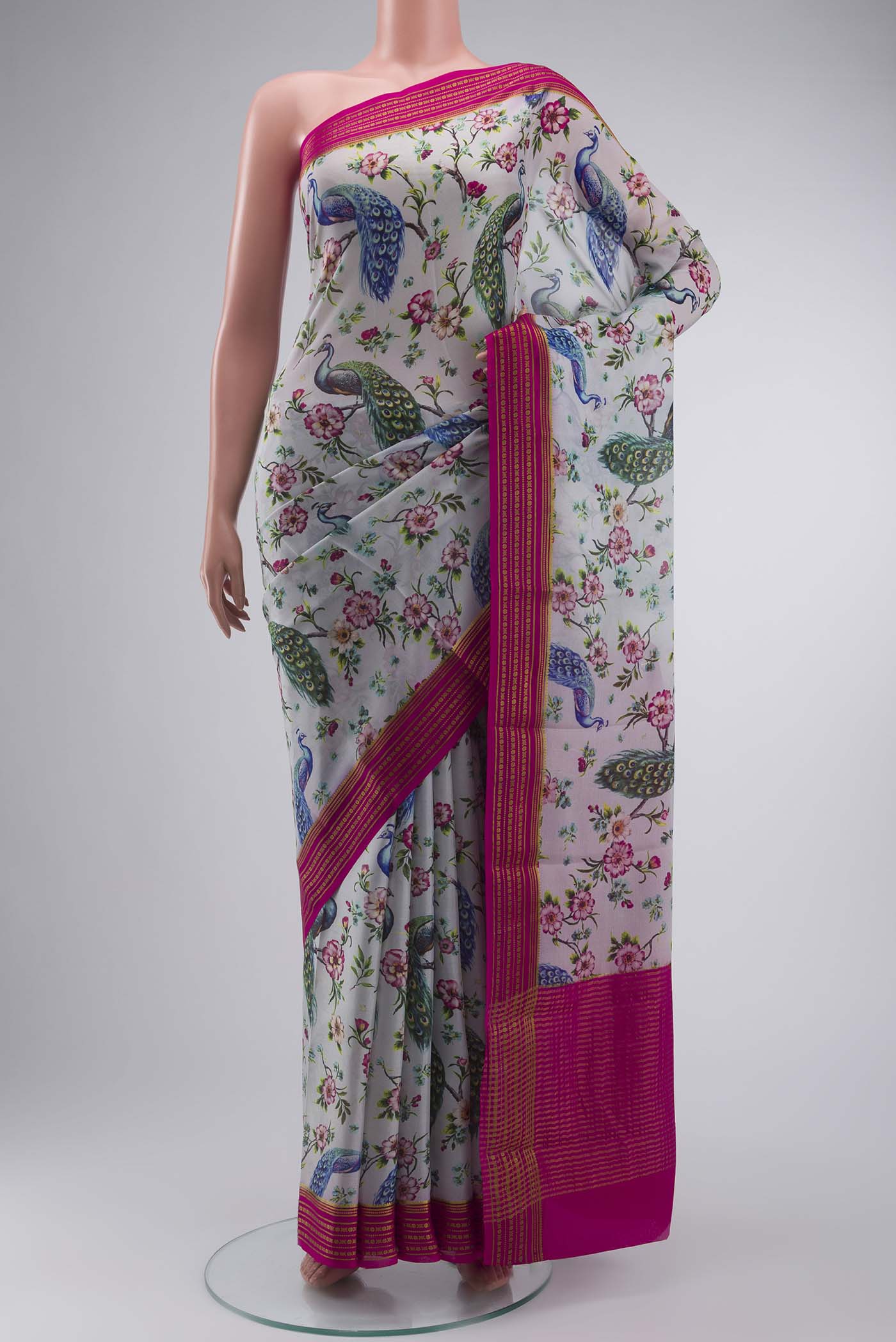 Grey Mysore Crepe Saree with Printed design on the body and Zari Border displayed on a mannequin