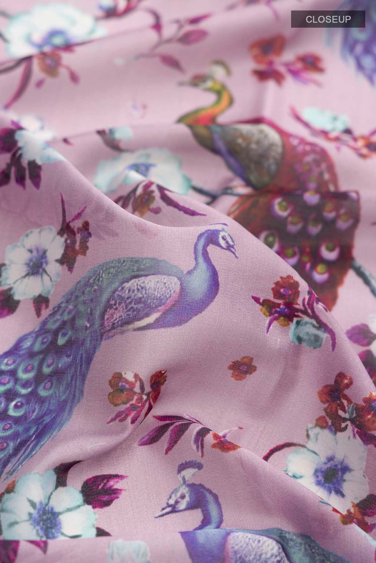 Close up of Lavender Mysore Crepe Saree with Printed design on the body and Zari Border displaying folds