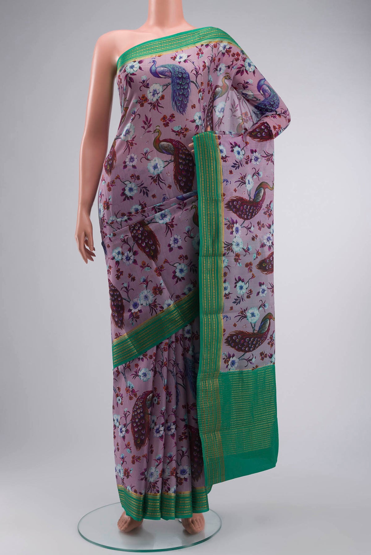 Lavender Mysore Crepe Saree with Printed design on the body and Zari Border displayed on a mannequin