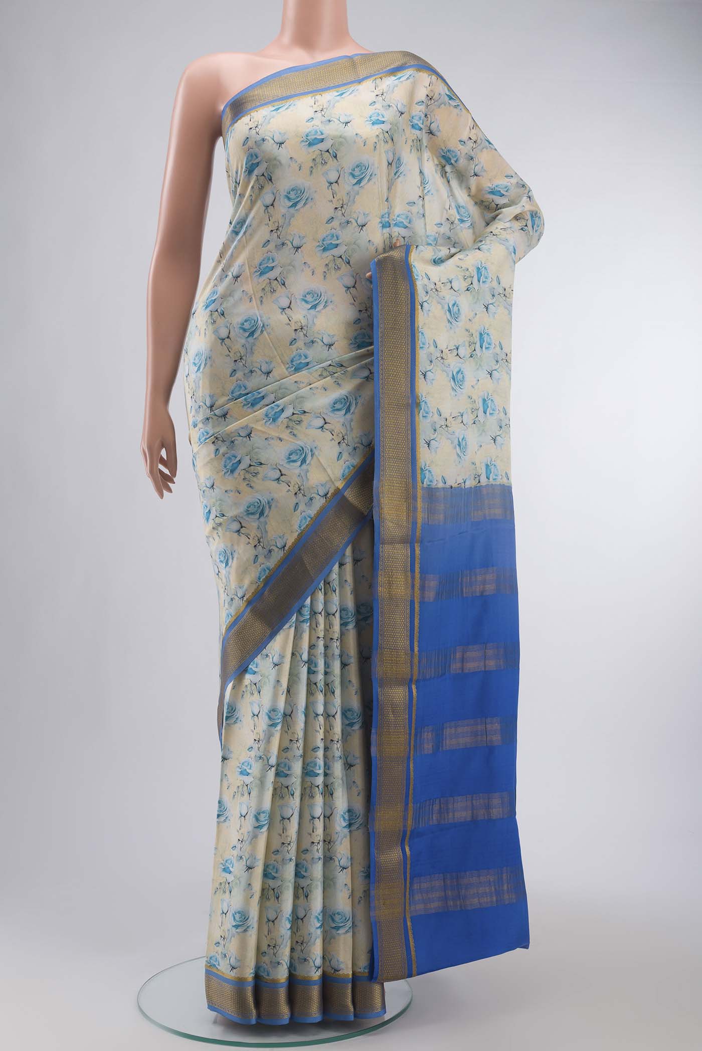 Cream Mysore Crepe Saree with Printed design on the body and Zari Border displayed on a mannequin