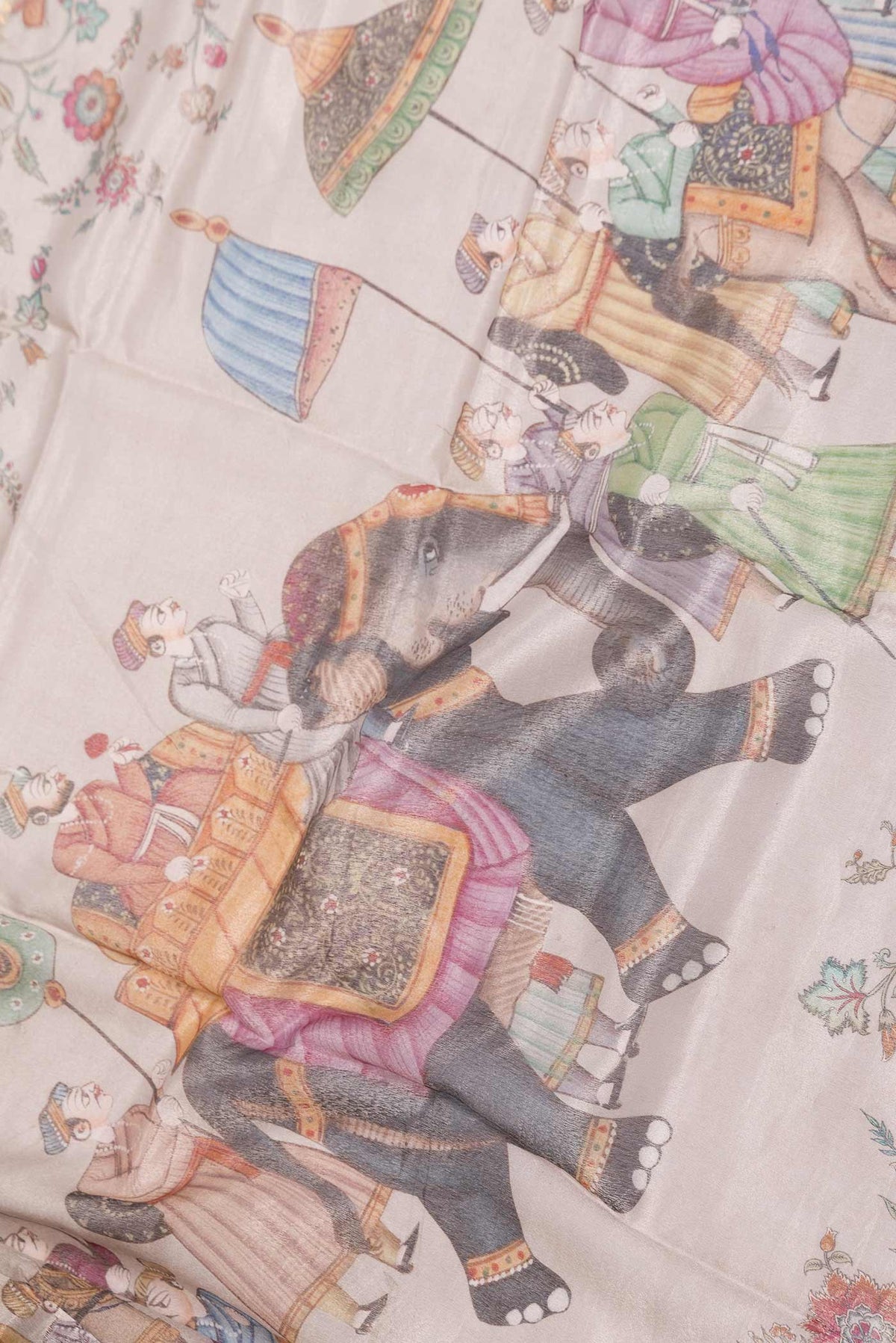 Close up of Bronze Dual Tone Organza Silk SareePrinted design on the body and Zari Border displaying folds