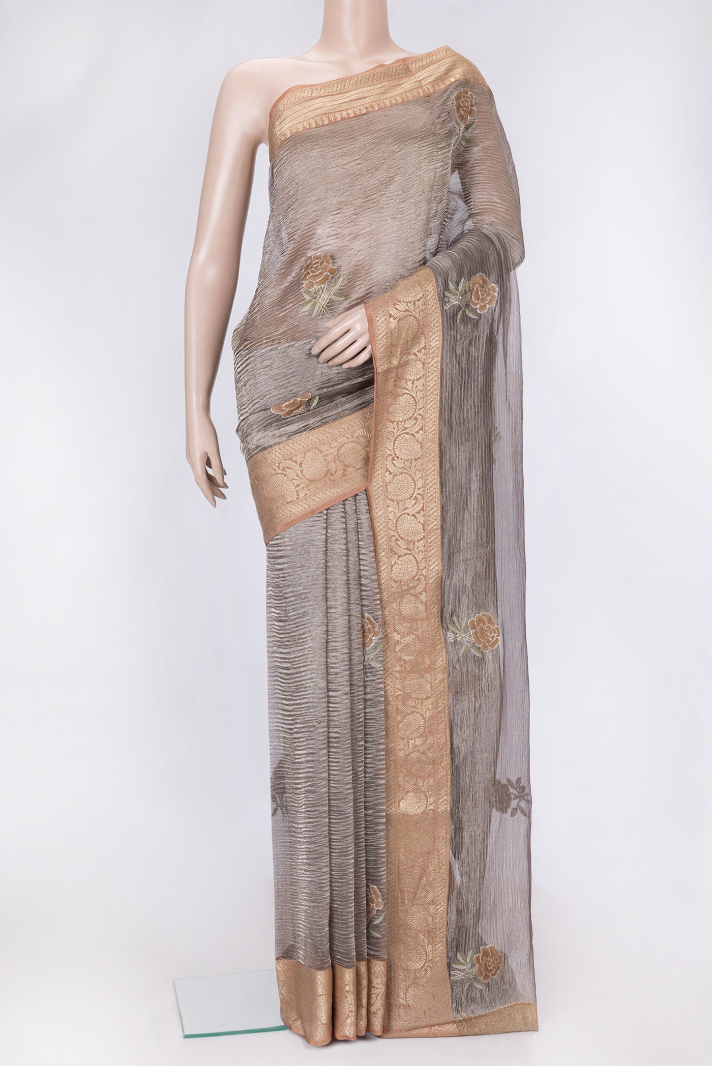 Brown Dual Tone Organza Silk Saree with Embroidery on the body and Zari Border.  displayed on a mannequin