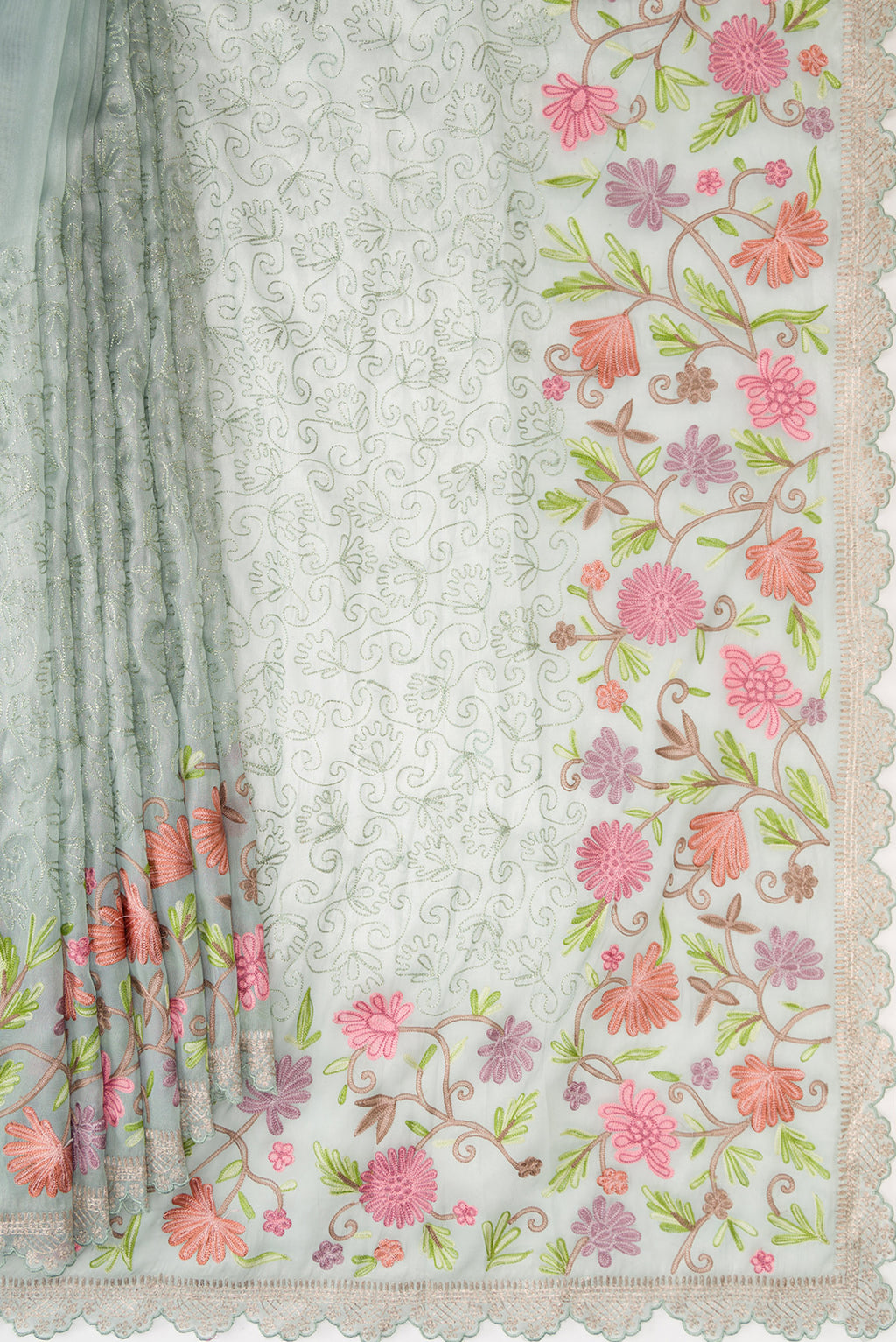 Pleats and pallu of Light Green Dual Tone Organza Silk Saree with Embroidery on the body and Embroidery Border. 