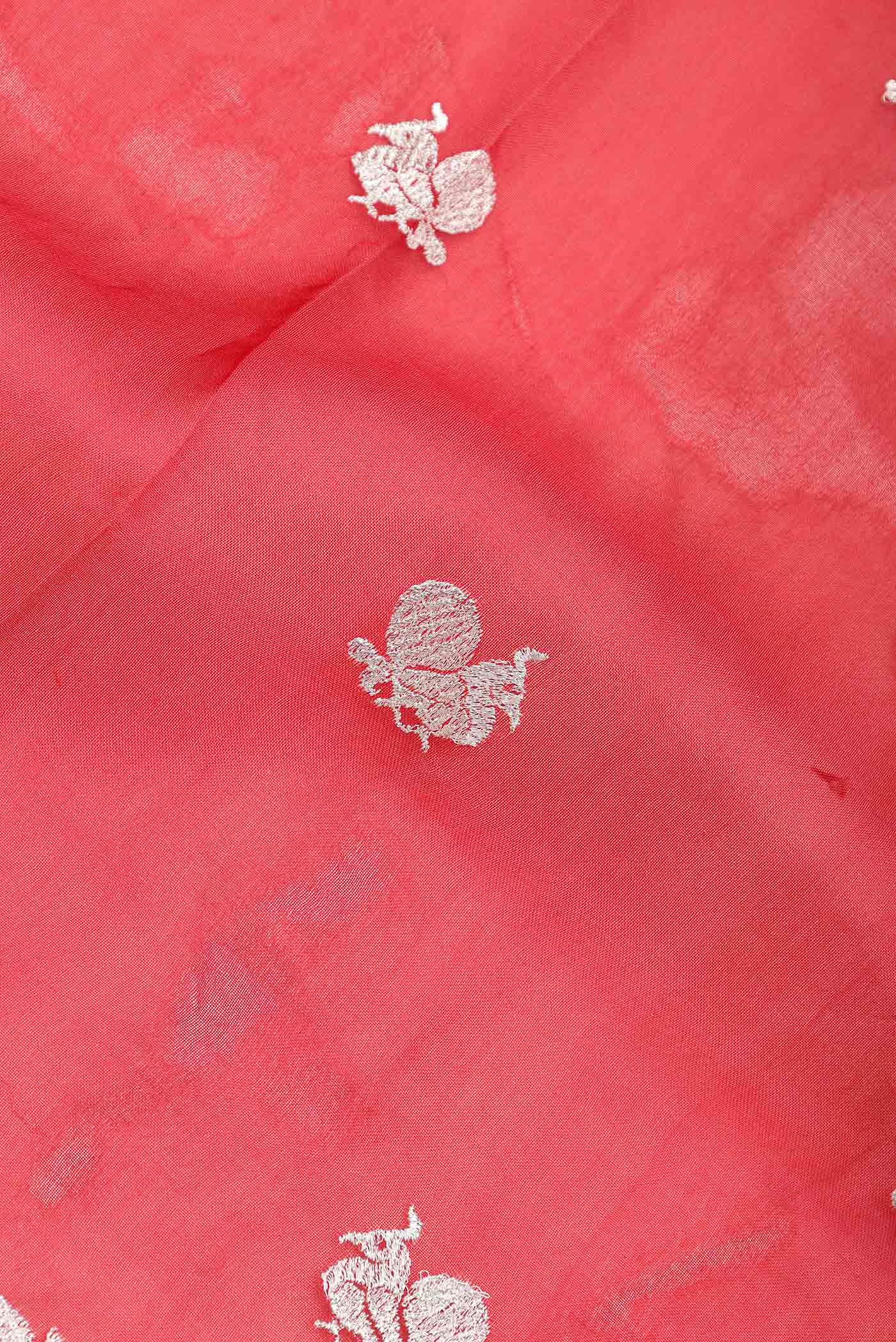 Close up of Red Dual Tone Organza Silk Saree with Zari Brocade on the body and Zari Border.  displaying folds