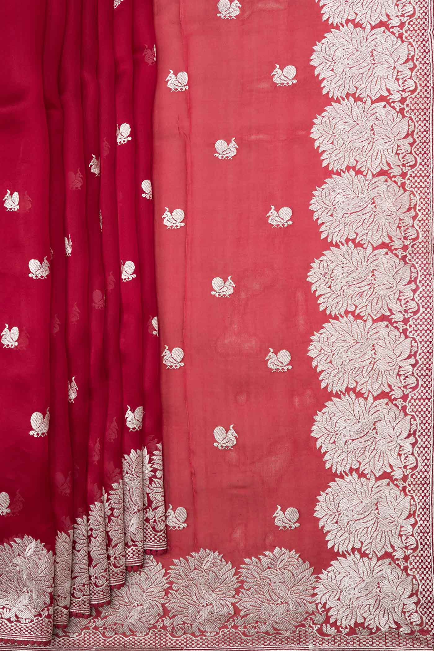 Pleats and pallu of Red Dual Tone Organza Silk Saree with Zari Brocade on the body and Zari Border. 