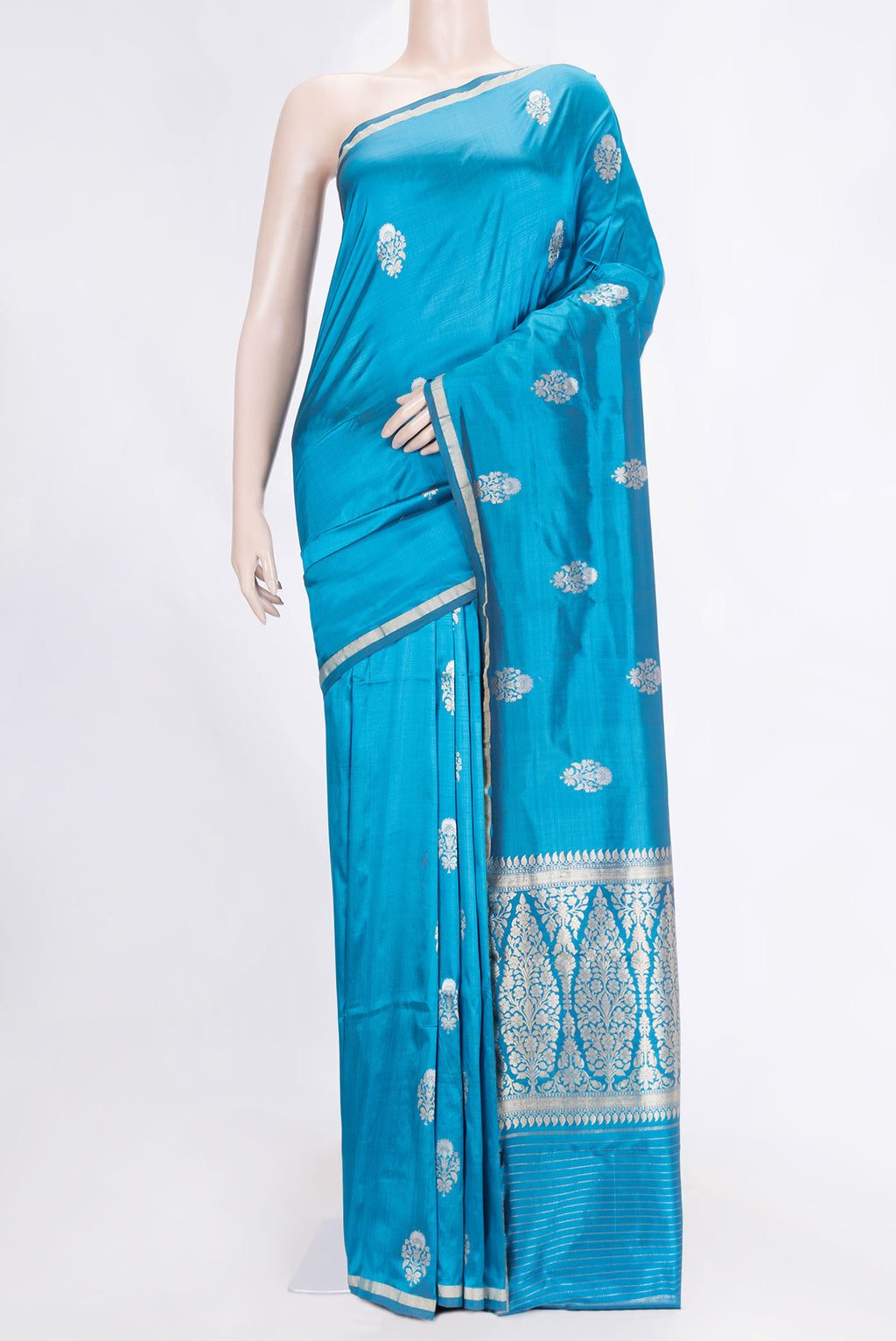 Peacock Blue Dual Tone Banarasi Silk Saree with Zari Butta on the body and Zari Border.  displayed on a mannequin
