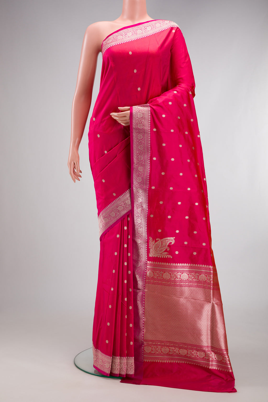 Pink Banarasi Silk Saree with Zari Butta on the body and Zari Border.  displayed on a mannequin