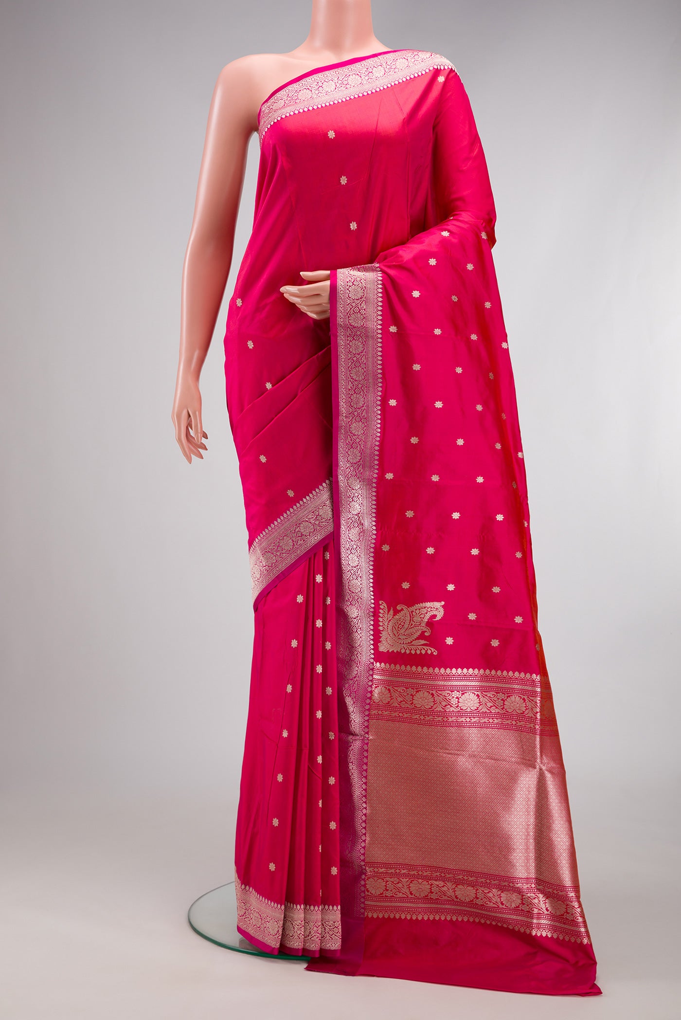 Pink Banarasi Silk Saree with Zari Butta on the body and Zari Border.  displayed on a mannequin