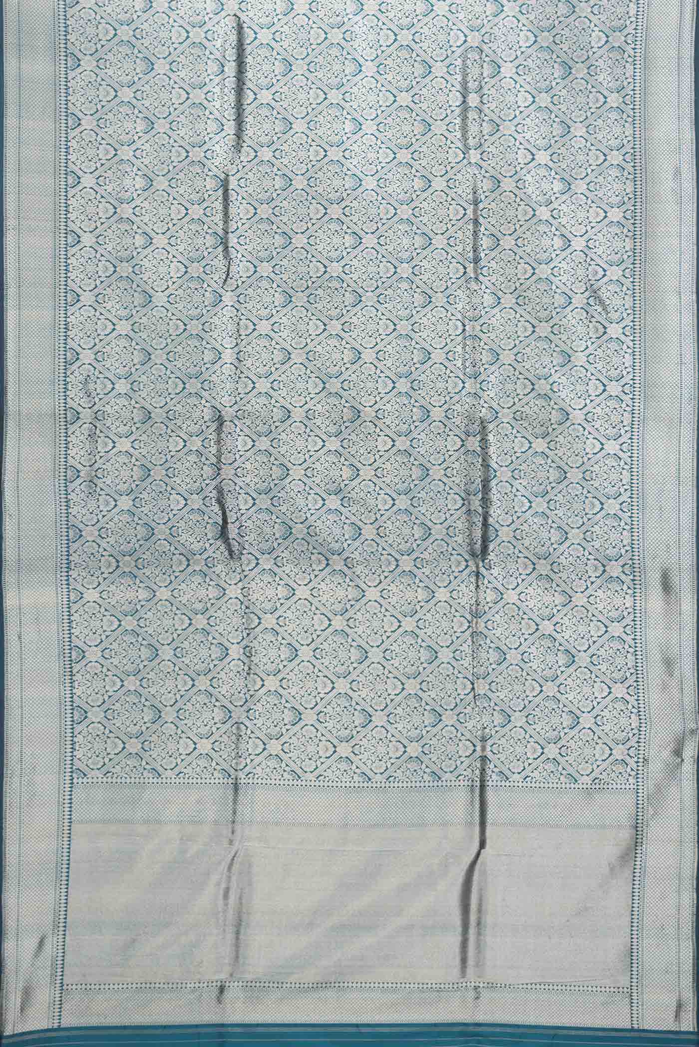 Flat view of Peacock Blue Dual Tone Banarasi Silk Saree with Zari Brocade on the body and Zari Border. 