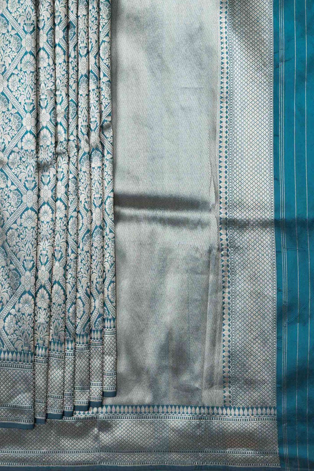 Pleats and pallu of Peacock Blue Dual Tone Banarasi Silk Saree with Zari Brocade on the body and Zari Border. 