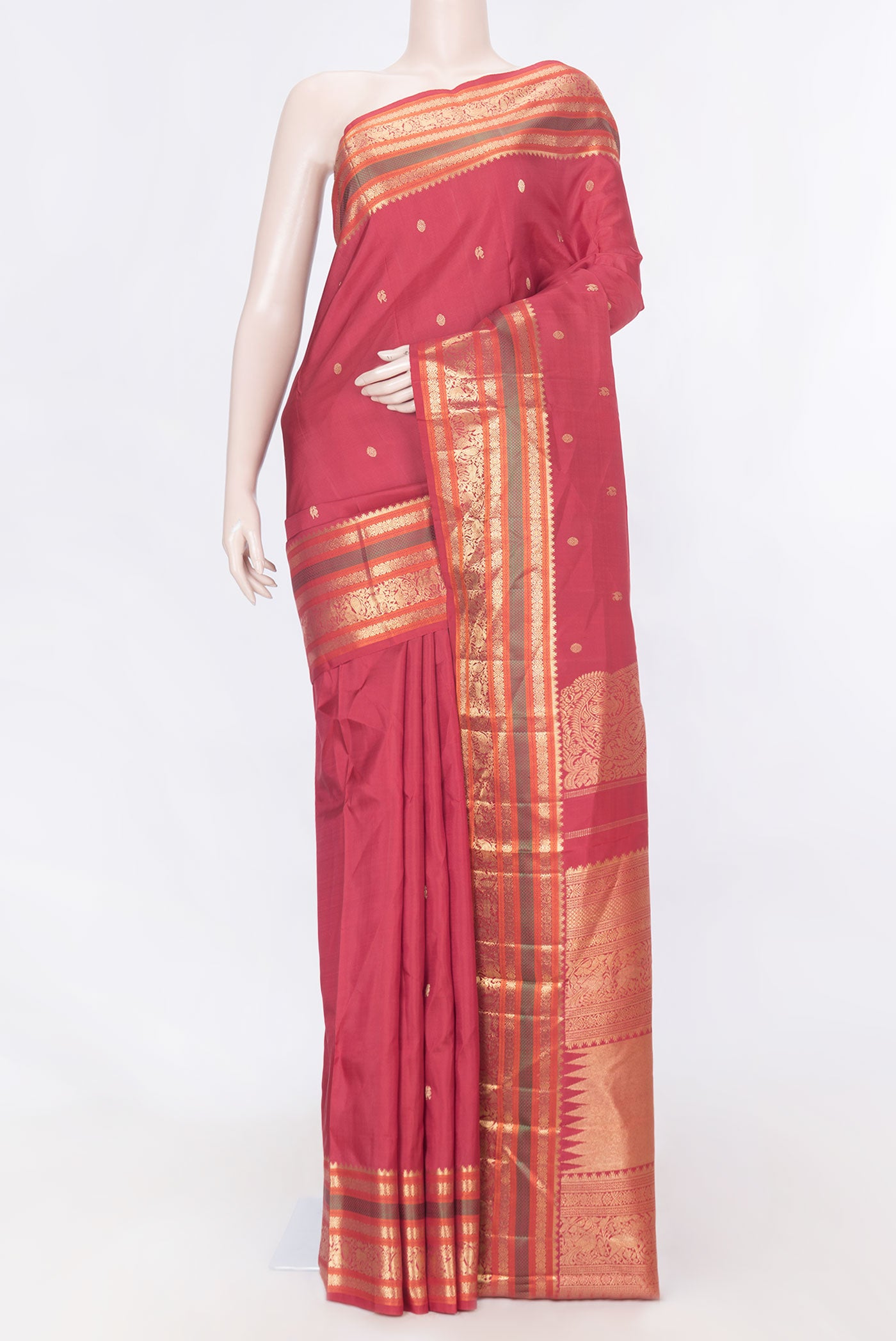 Pure Silk Pure Zari Maroon Dual Tone Kanchipuram Saree with Zari Butta on the body and Zari Border displayed on a mannequin