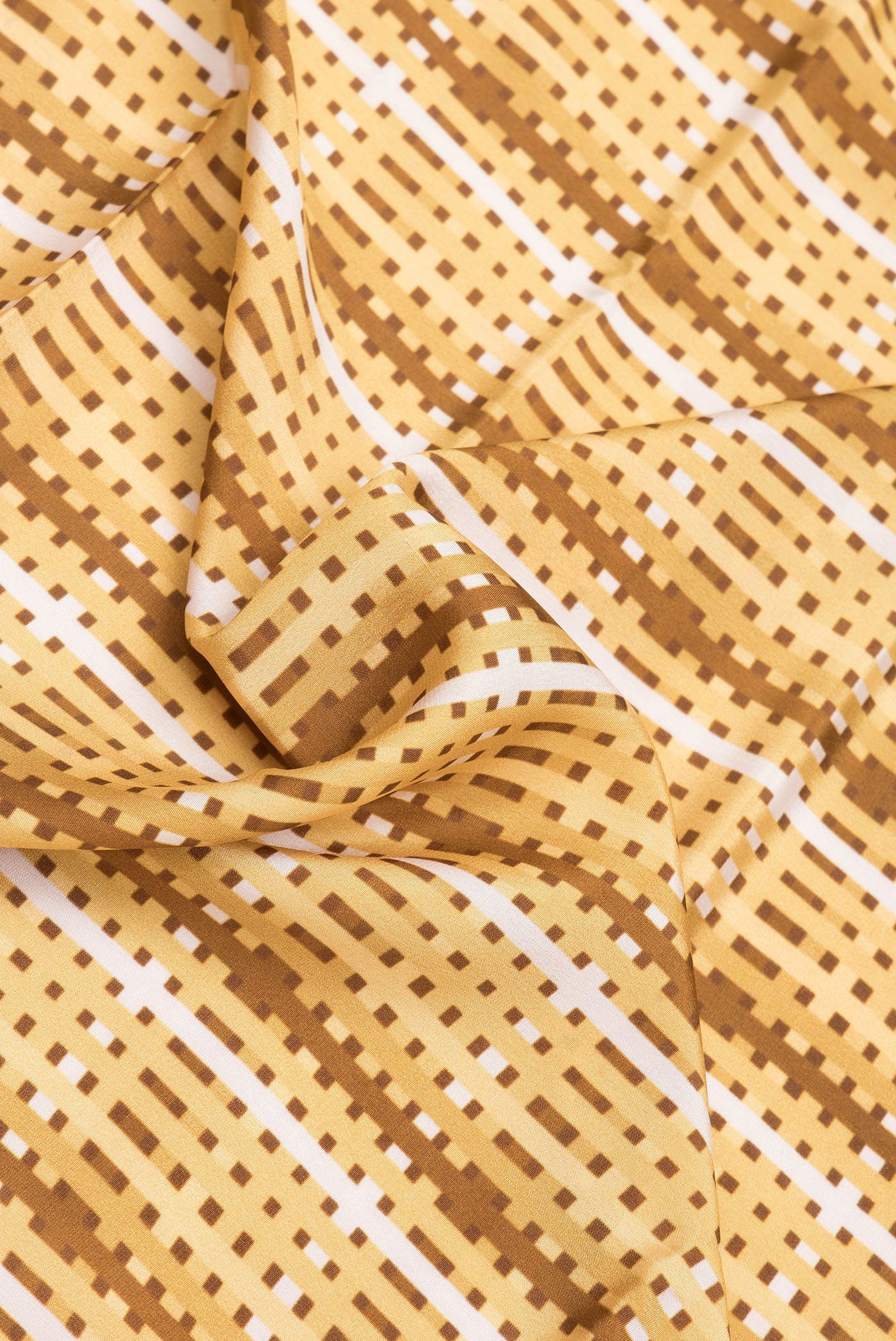 Close up of Sandal Mysore Crepe Saree with Printed design on the body and Zari Border.  displaying folds