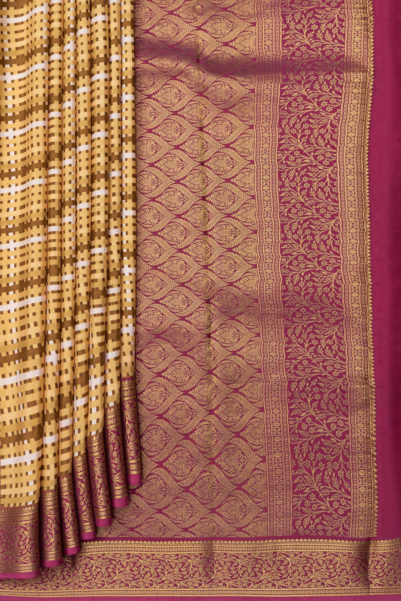 Pleats and pallu of Sandal Mysore Crepe Saree with Printed design on the body and Zari Border. 