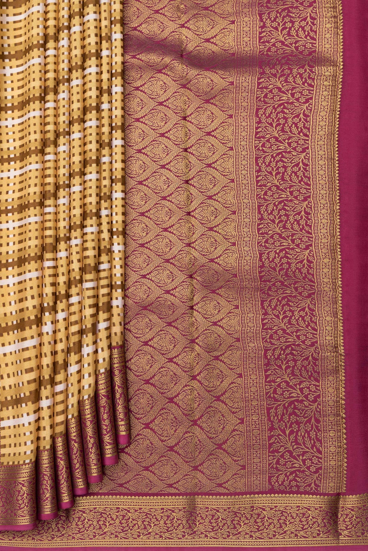 Pleats and pallu of Sandal Mysore Crepe Saree with Printed design on the body and Zari Border. 