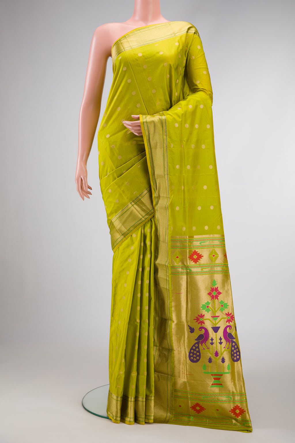 Parrot Green Dual Tone Paithani Silk Saree with Zari Butta on the body and Zari Border.  displayed on a mannequin