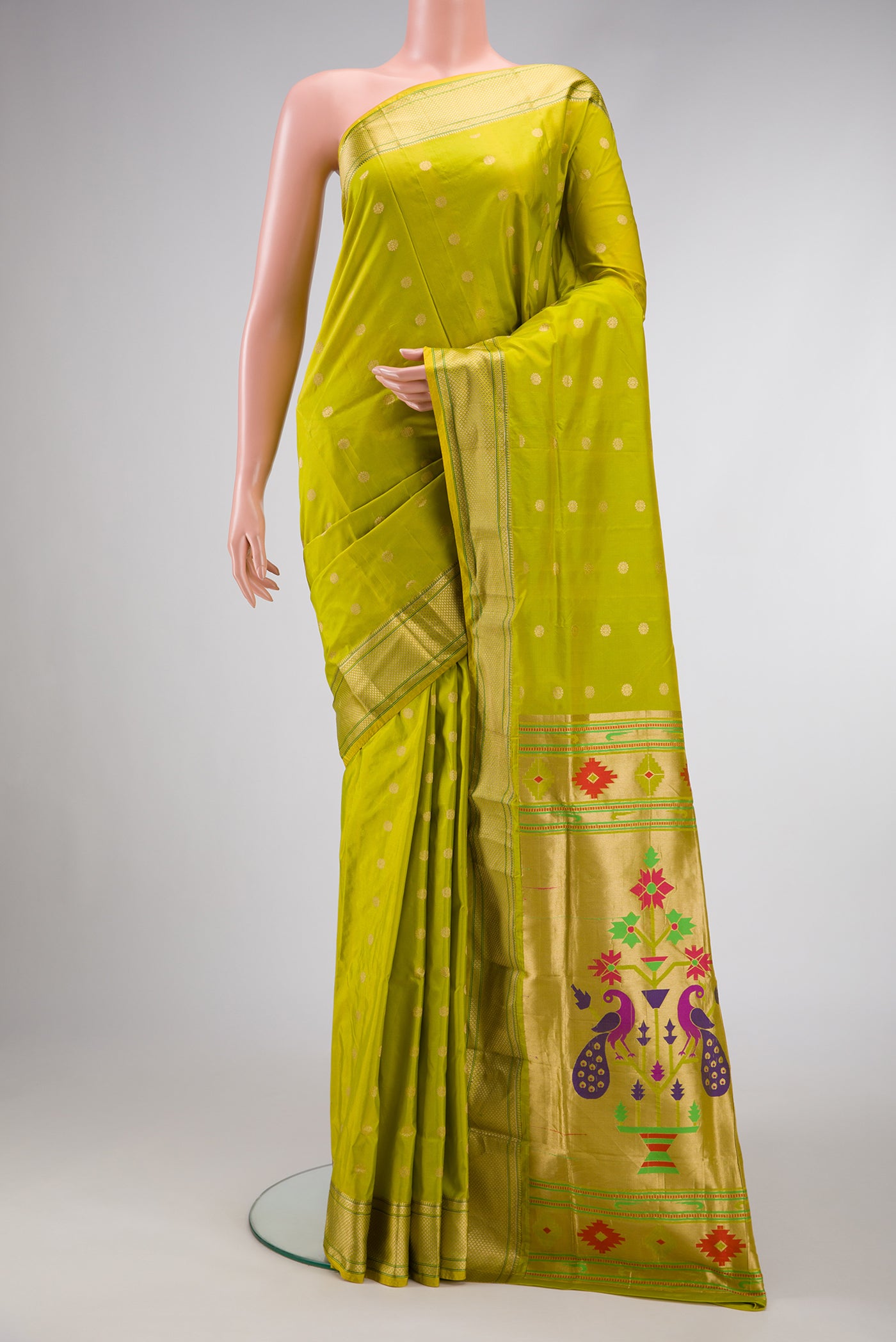 Parrot Green Dual Tone Paithani Silk Saree with Zari Butta on the body and Zari Border.  displayed on a mannequin