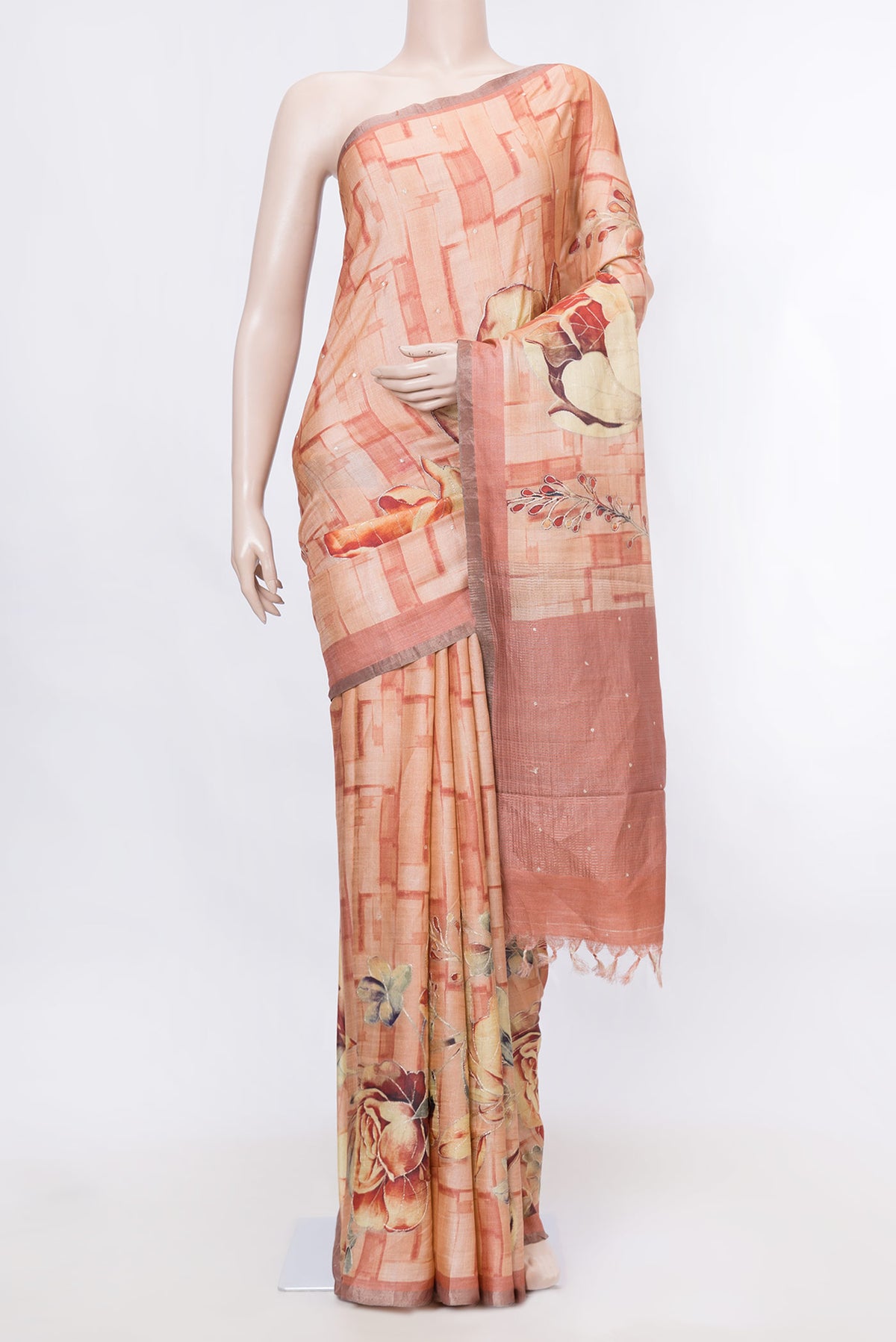 Peach Dual Tone Tussar Silk SareePrinted design on the body and Plain Border displayed on a mannequin