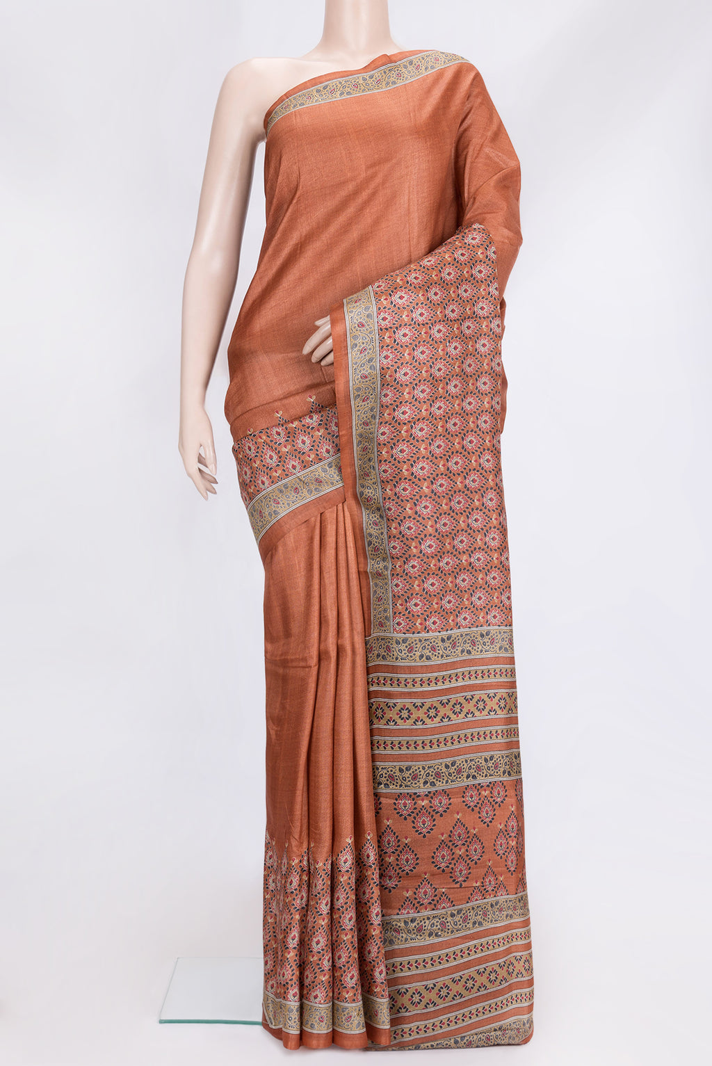 Orange Dual Tone Tussar Silk Saree with Printed design on the body and Printed Border.  displayed on a mannequin