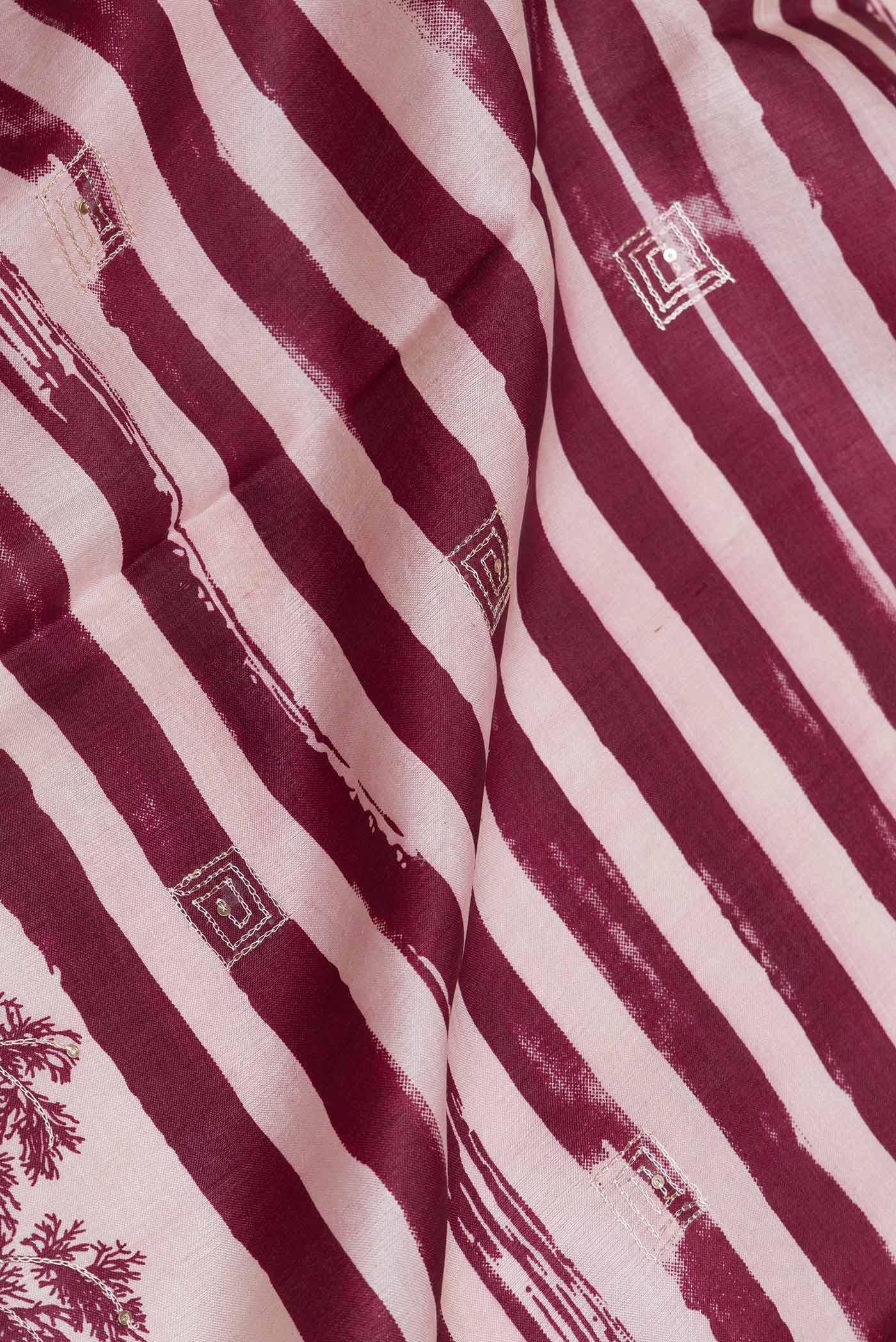 Close up of Pink Dual Tone Tussar Silk SareePrinted design on the body and Plain Border displaying folds