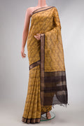 Mustard Dual Tone Tussar Silk Saree with Printed design on the body and Zari Border.  displayed on a mannequin