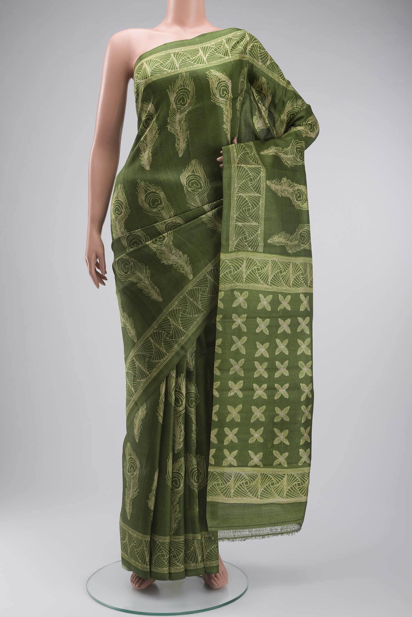 Green Tussar Silk Saree with Printed design on the body and Printed Border displayed on a mannequin