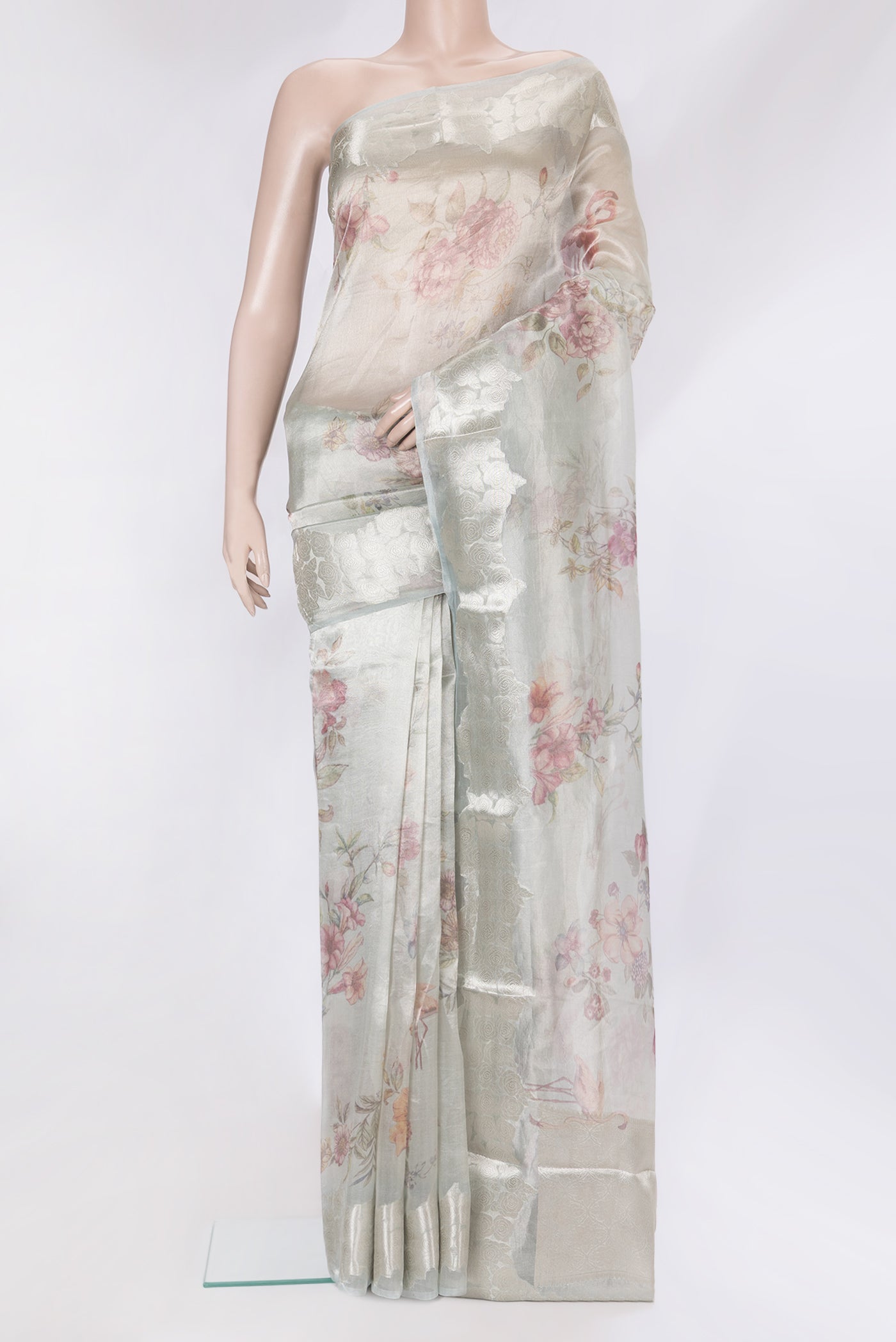 Grey Organza Silk Saree with Printed design on the body and Fancy Border.  displayed on a mannequin