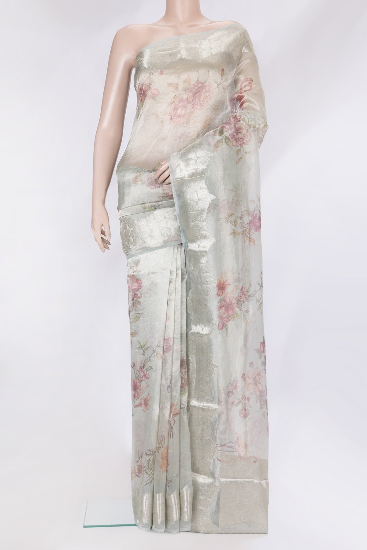 Grey Organza Silk Saree with Printed design on the body and Fancy Border.  displayed on a mannequin