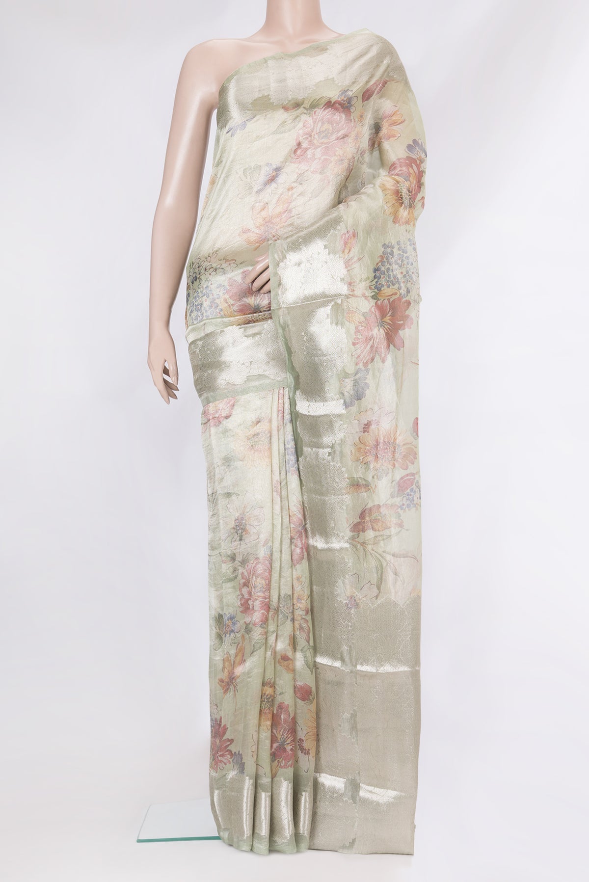 Pista Green Dual Tone Organza Silk Saree with Printed design on the body and Fancy Border.  displayed on a mannequin