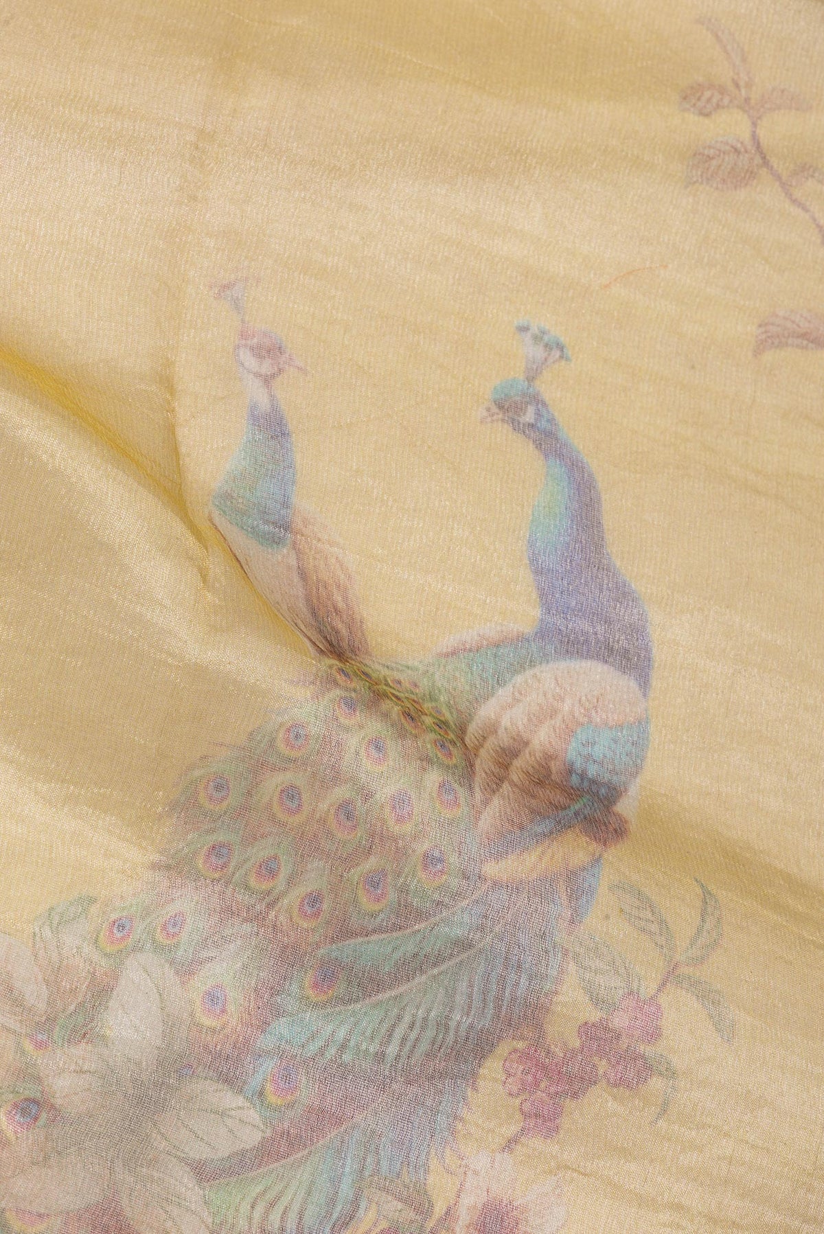 Close up of Yellow Dual Tone Organza Saree with Zari Brocade on the body and Fancy Border.  displaying folds
